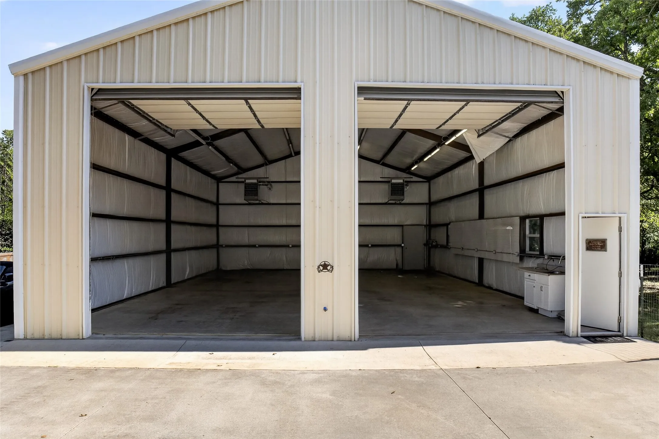 This is one of the most unbelievable 30x50 workshops! It is heated with its own propane tank, has a utility sink and large doors to accommodate RV parking