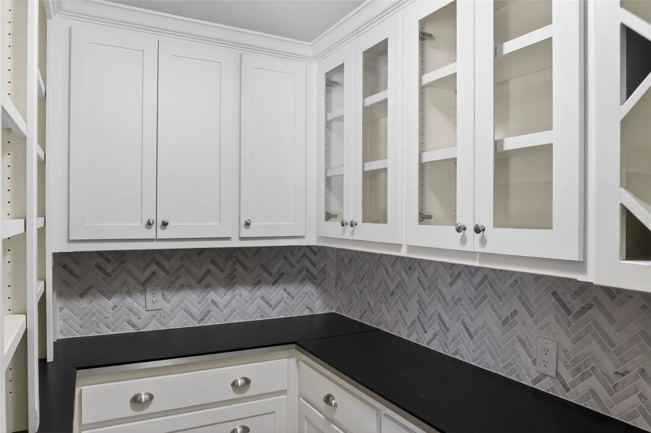 One of the greatest features of this kitchen is the huge walk-in custom pantry  - there's so much counterspace and cabinets to keep things organized and well displayed
