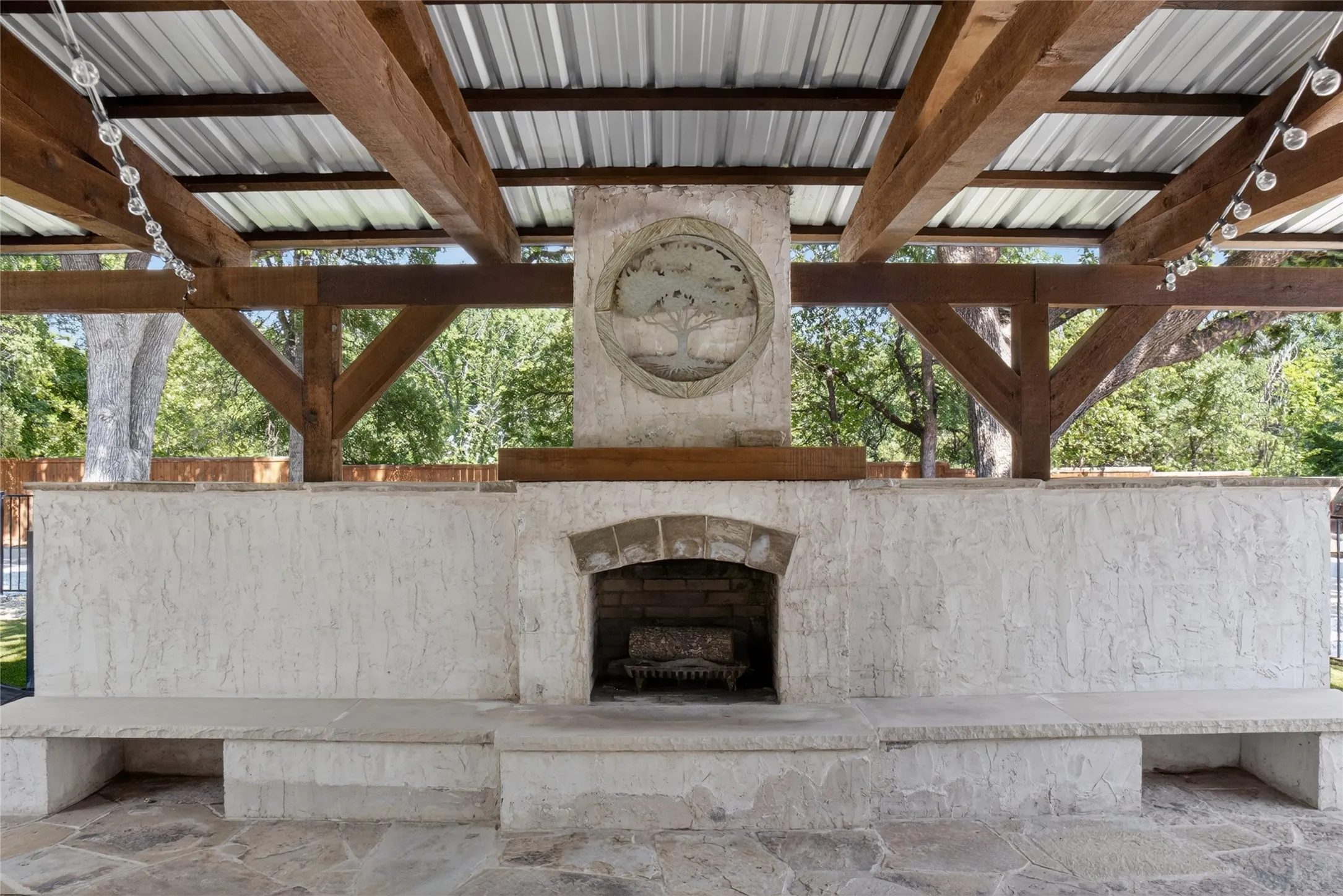 This outdoor living area is one of the greatest features of this home! It has wood burning fireplace, fenced in dog run, with direct access from the kitchen.