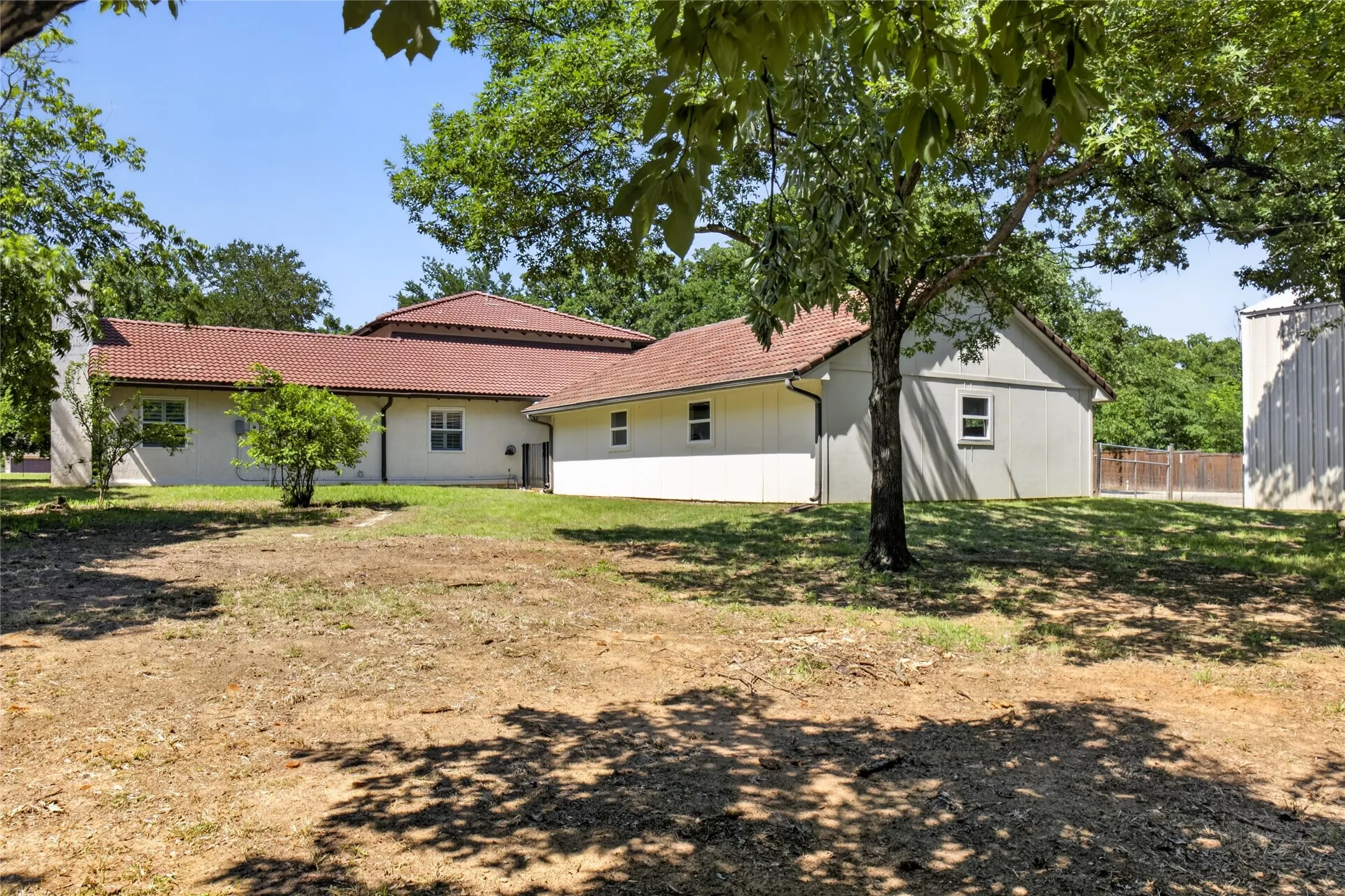 View of the home from the back. Home sits on 3.26 acres and back to Poindexter Creek