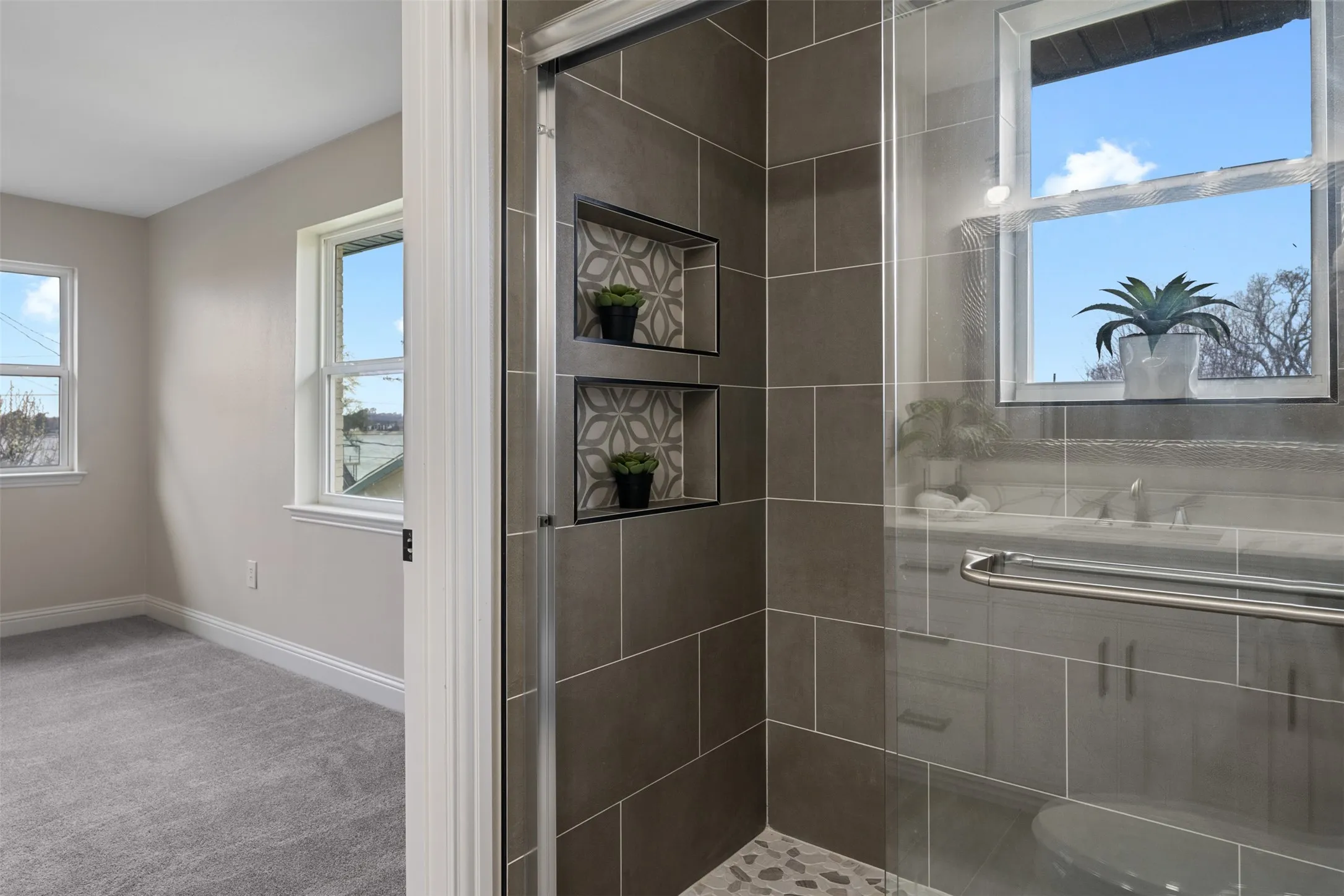Walk-in shower with designer tile details