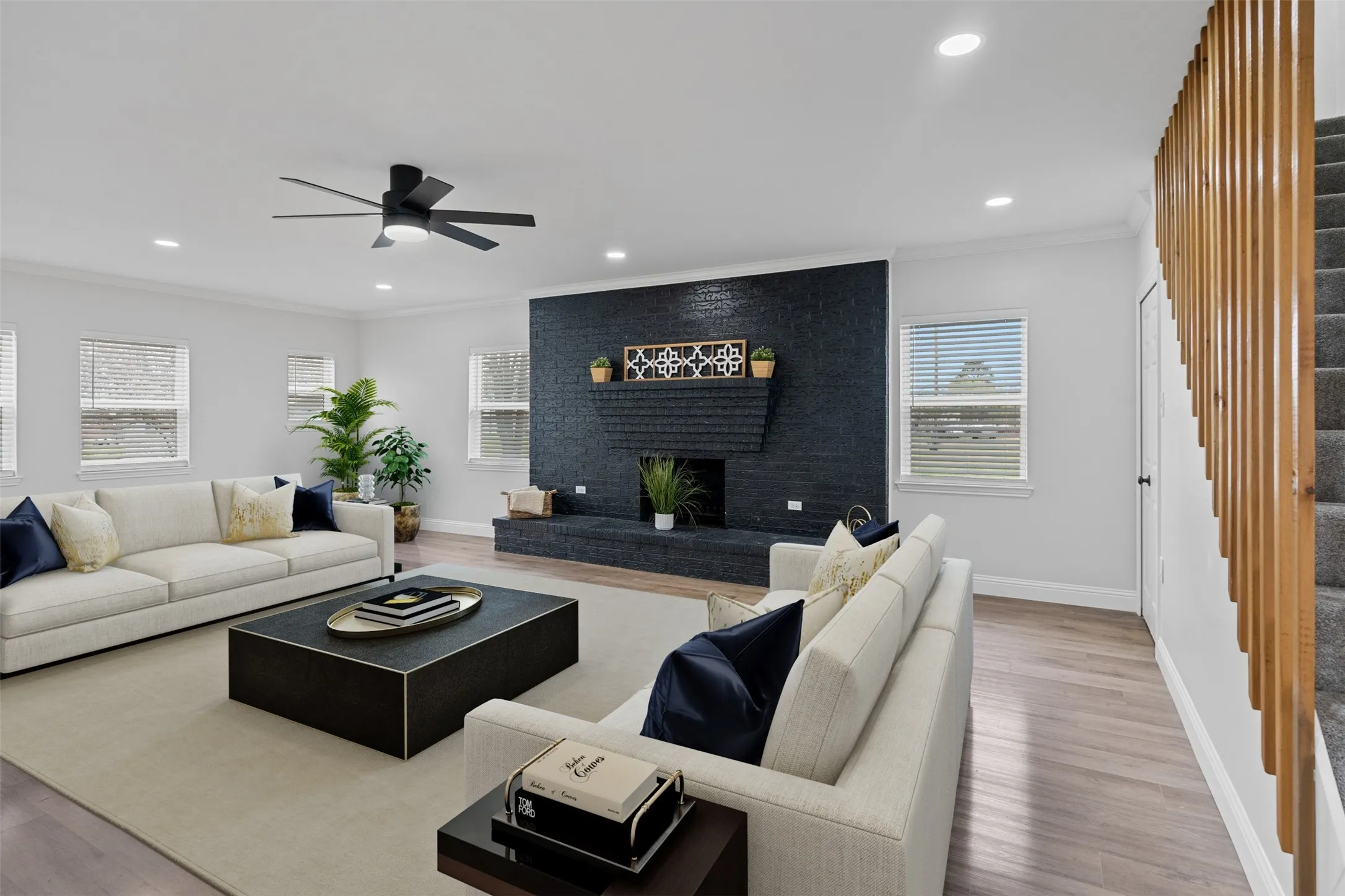 Spacious living room anchored by striking fireplace feature wall