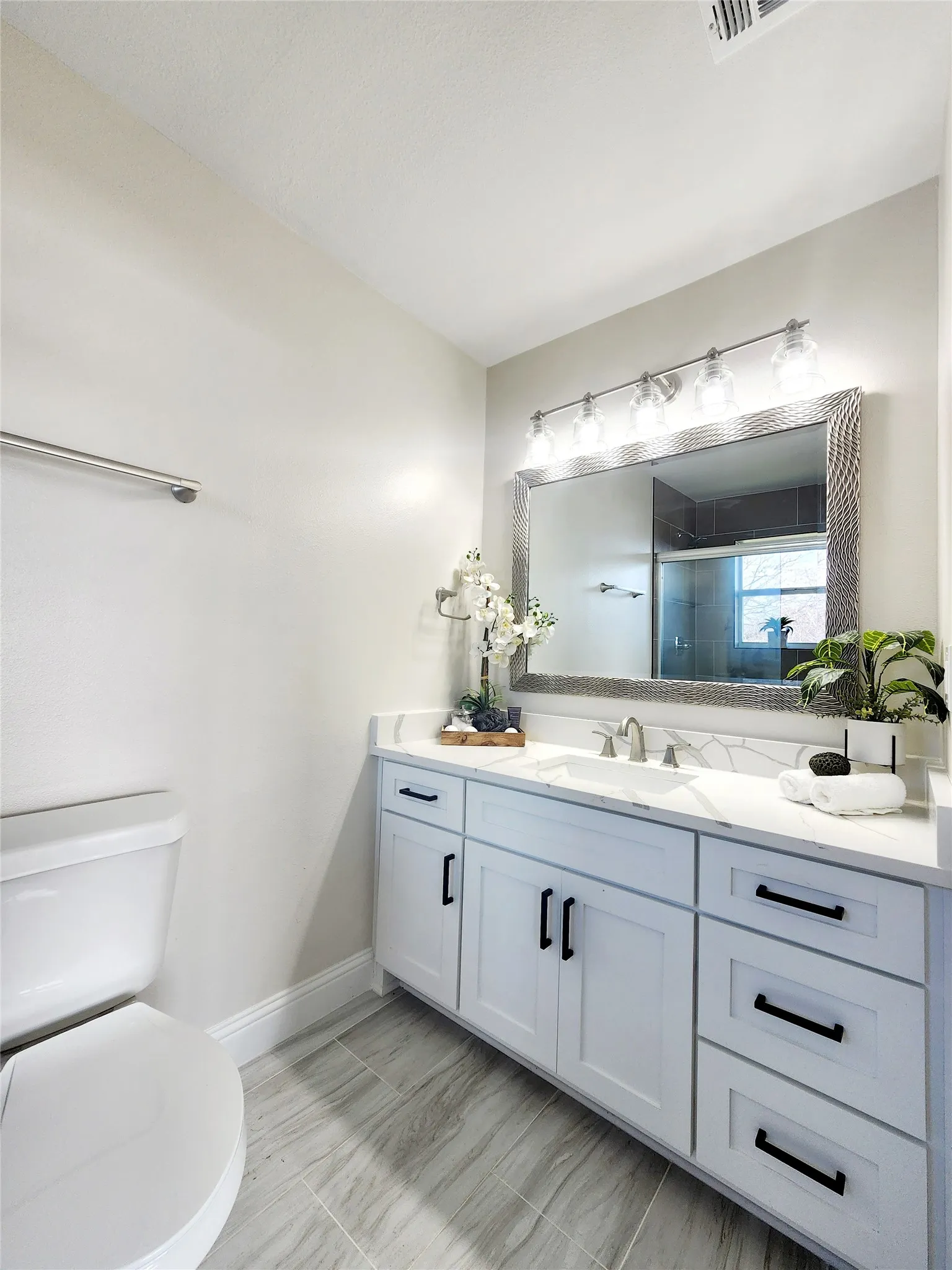 Updated primary bath with modern finishes