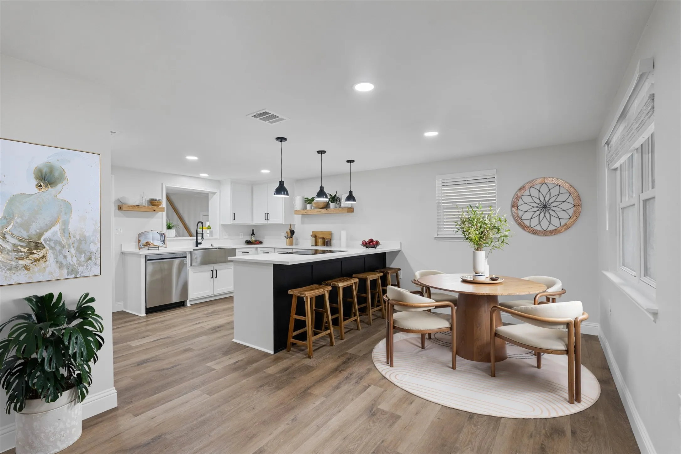 Open kitchen and dining area designed for gathering and entertaining