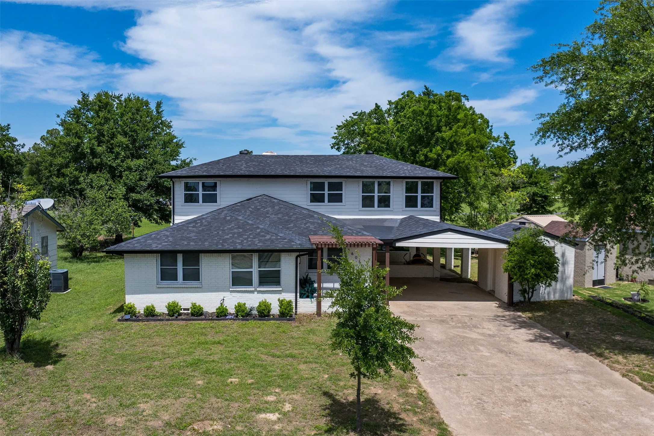 Beautifully renovated home with modern curb appeal and covered parking