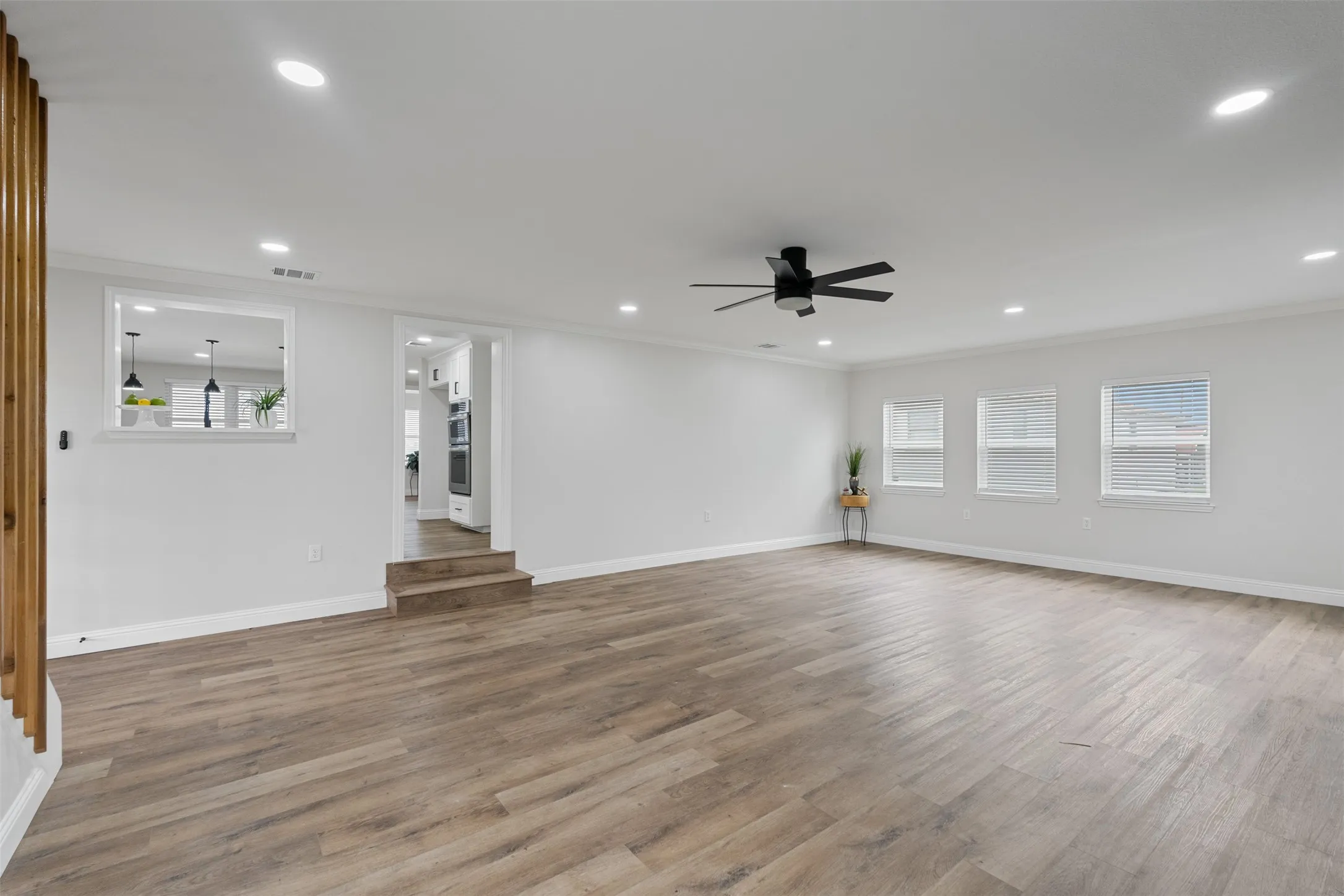 Bright open-concept design connects everyday living and entertaining spaces