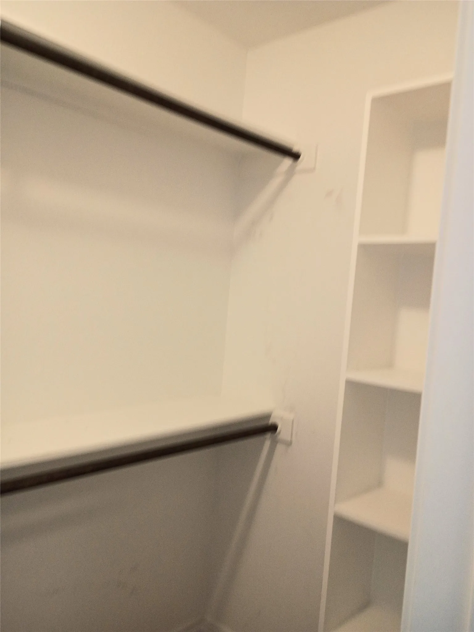 Other side of master closet showing sweater shelves