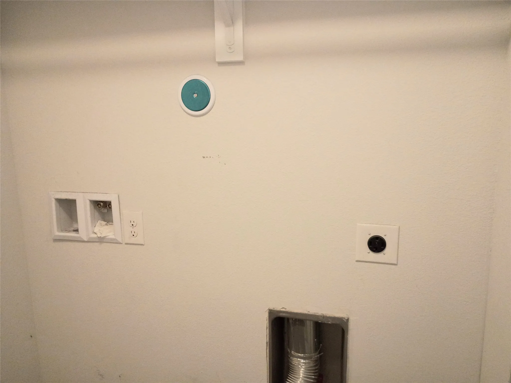 Laundry room between house and garage