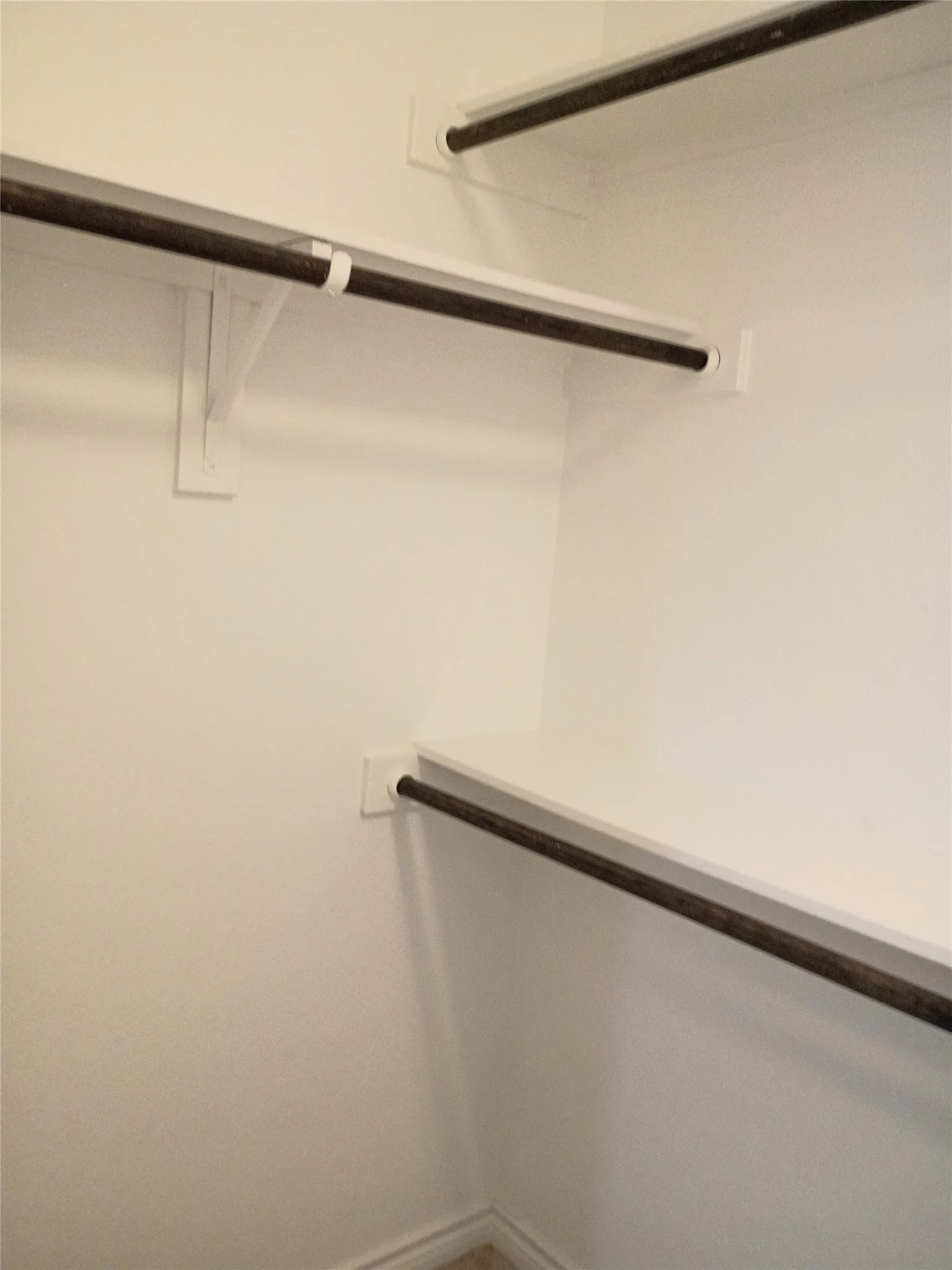 Double rods in one side of master bedroom closet
