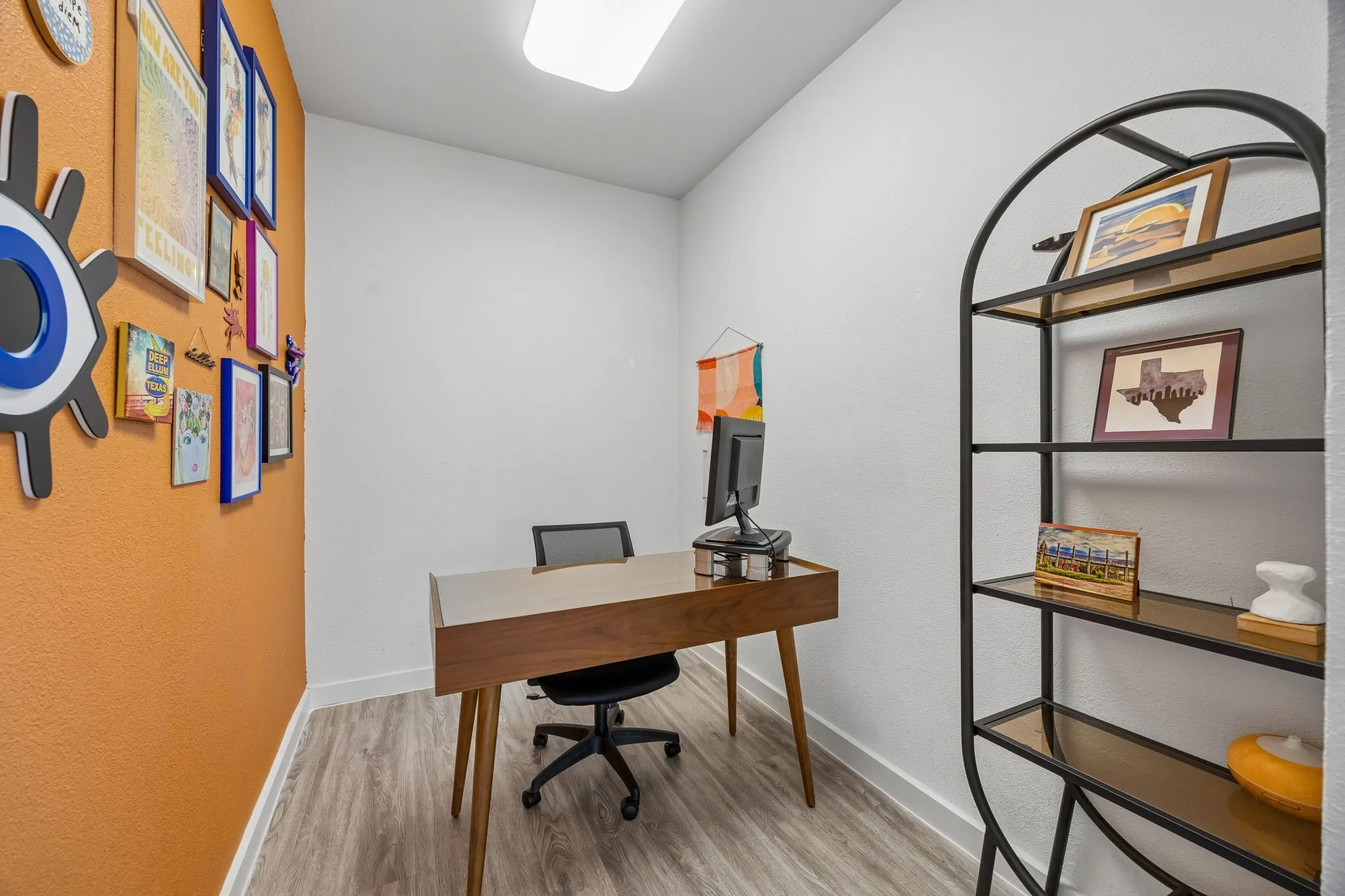 Currently utilized as a home office, this flexible space was originally designed as a secondary walk-in closet and can easily be reconfigured to suit a variety of lifestyle needs.