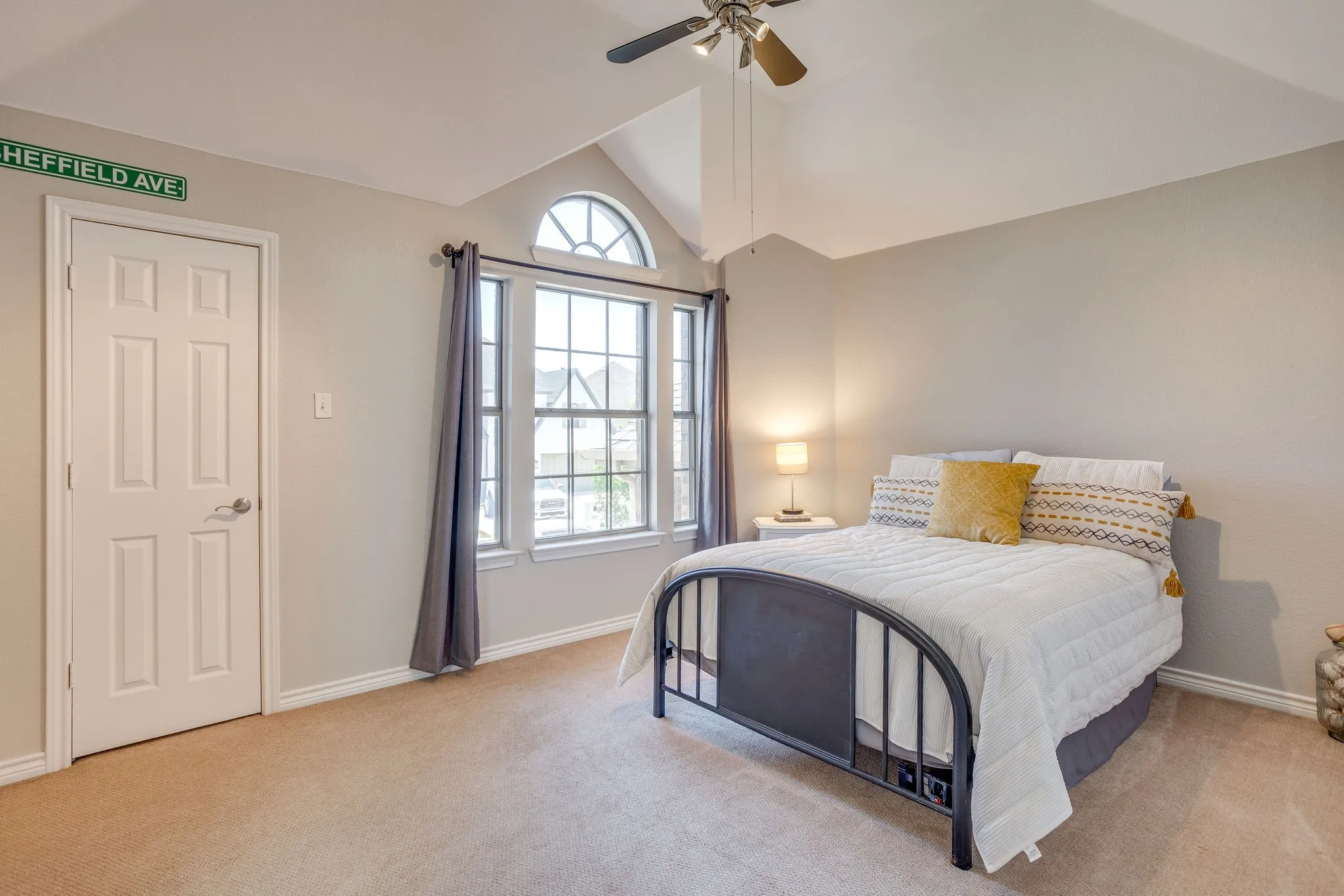 Vaulted ceilings with a ceiling fan overhead