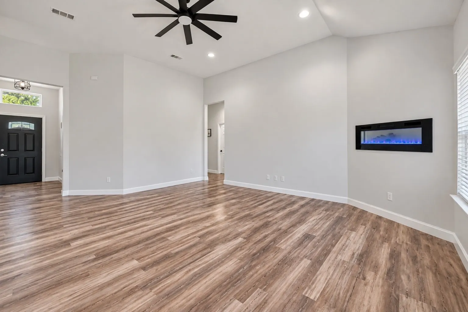 Wood-finish flooring, vaulted ceilings, and recessed lighting
