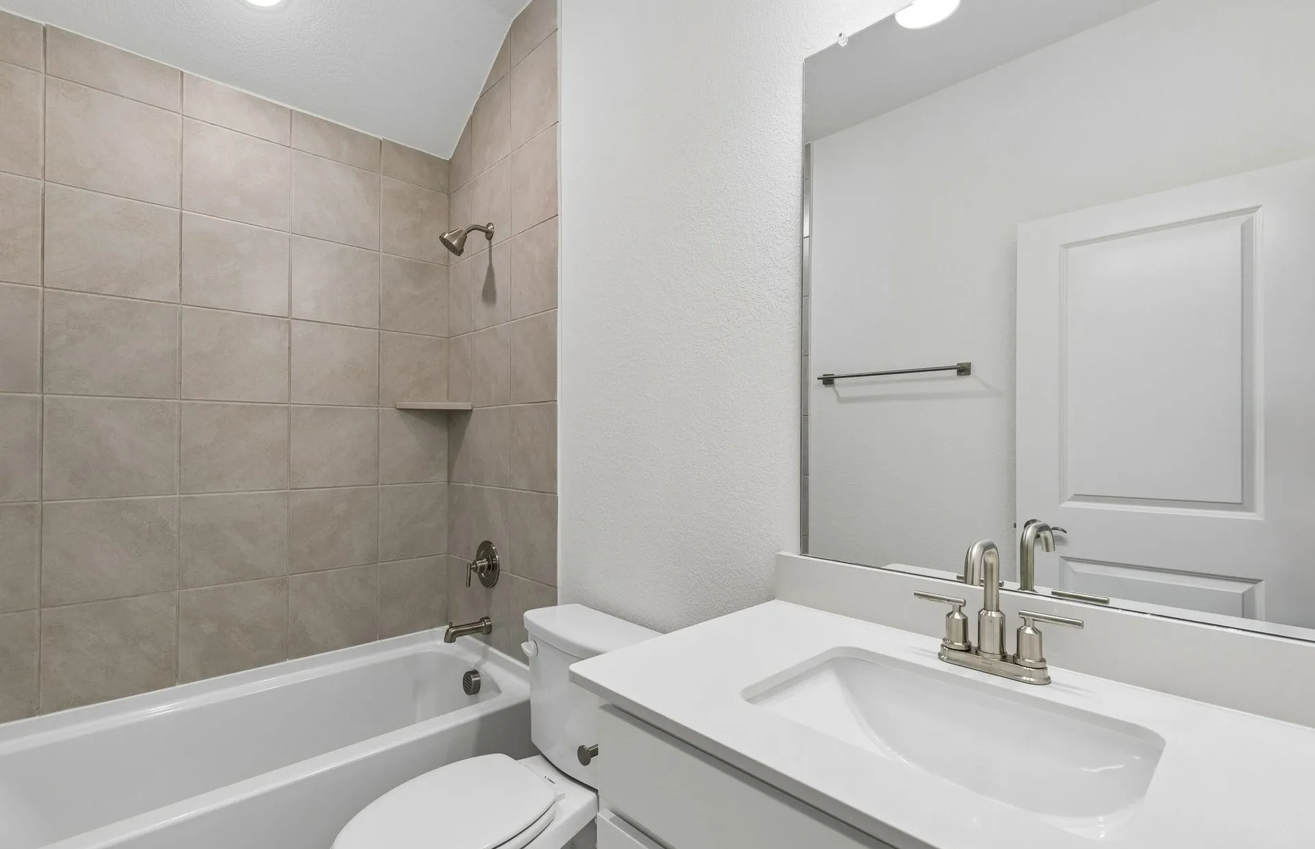 Secondary bath with tile surrounded shower