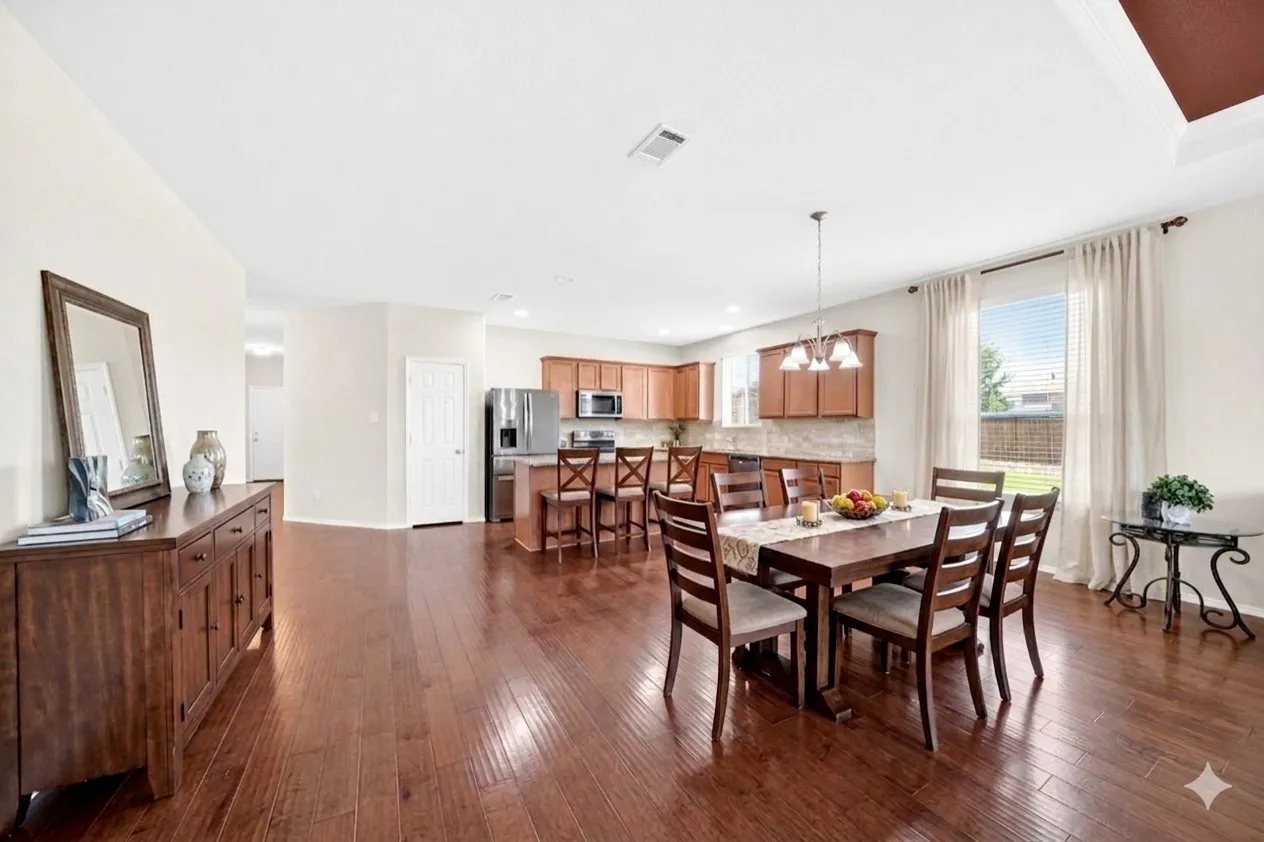 Virtually staged to showcase the possibilities of the open-concept layout and help visualize how the space can be furnished and utilized.