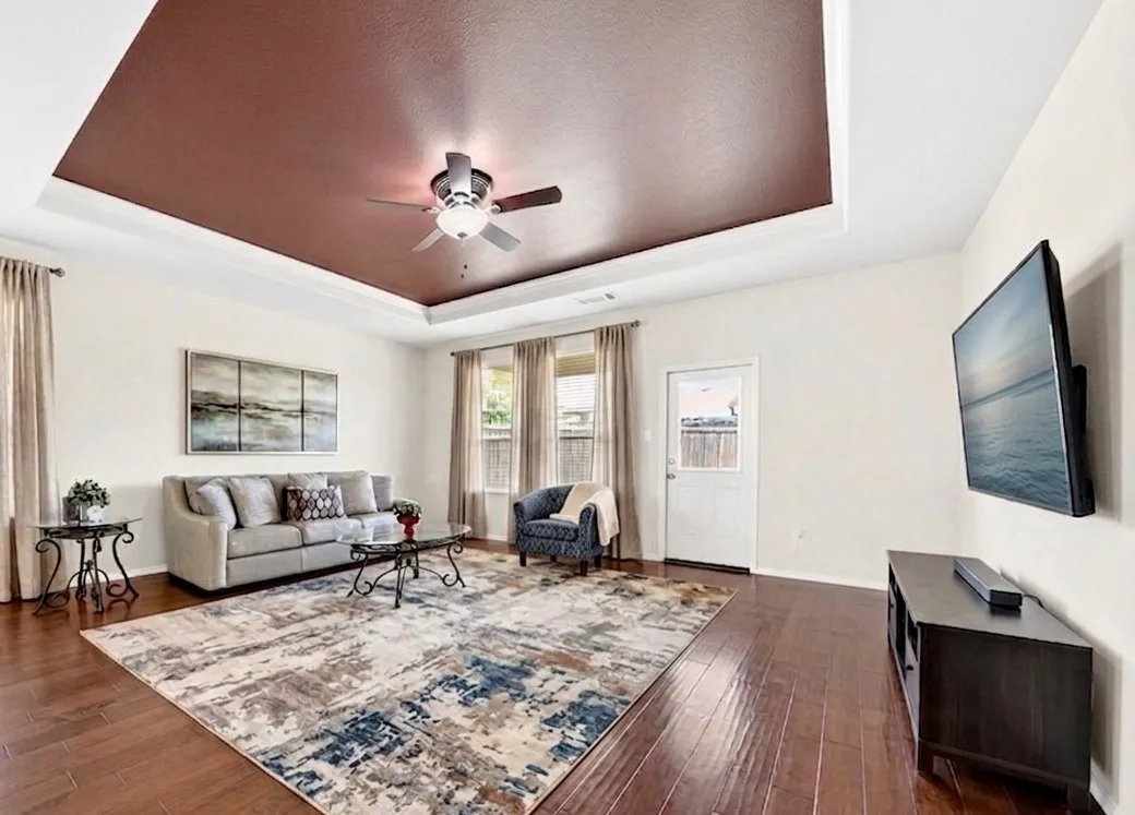 Virtually staged to showcase the possibilities of the open-concept layout and help visualize how the space can be furnished and utilized.