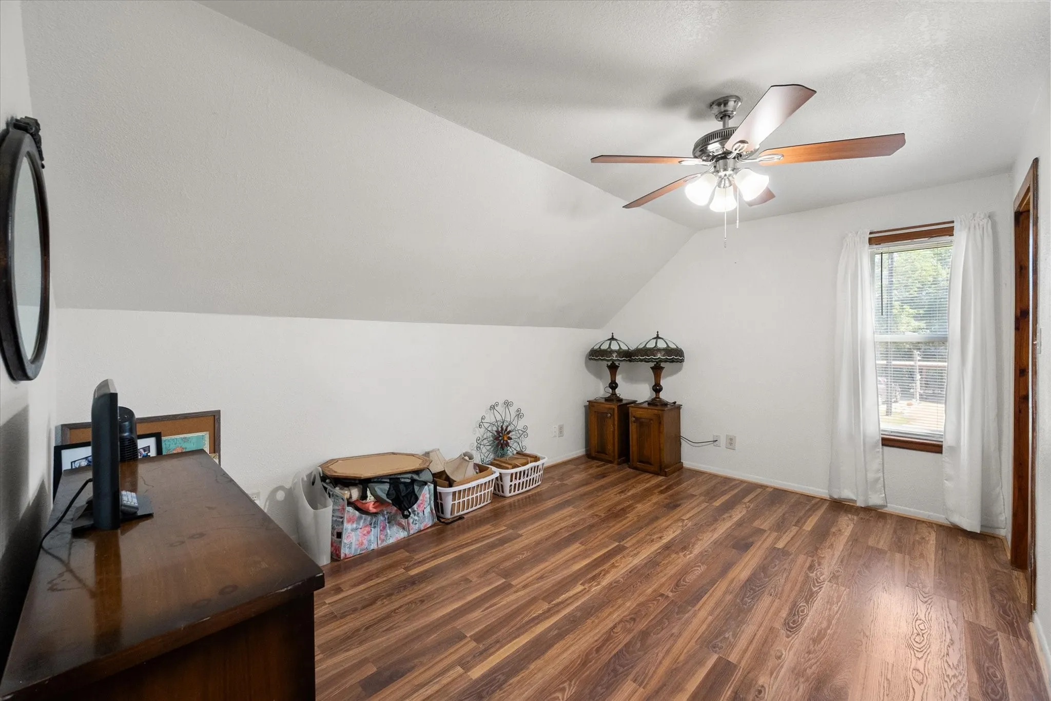 Large upstairs bonus room offering flexible living, recreation, or office space.