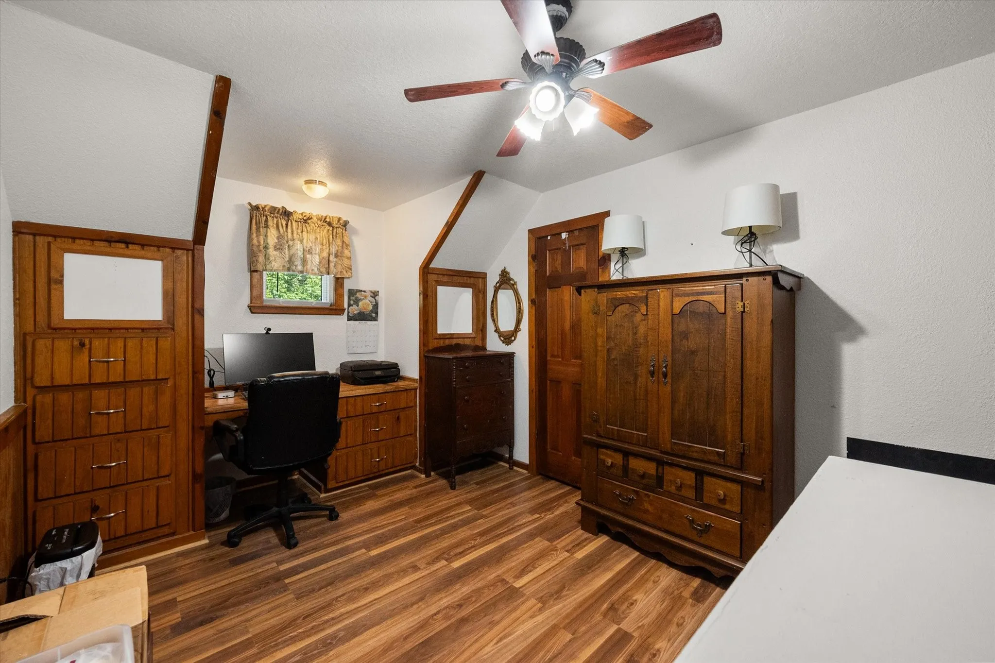 Upstairs bedroom ideal for guests, family, or home office use.