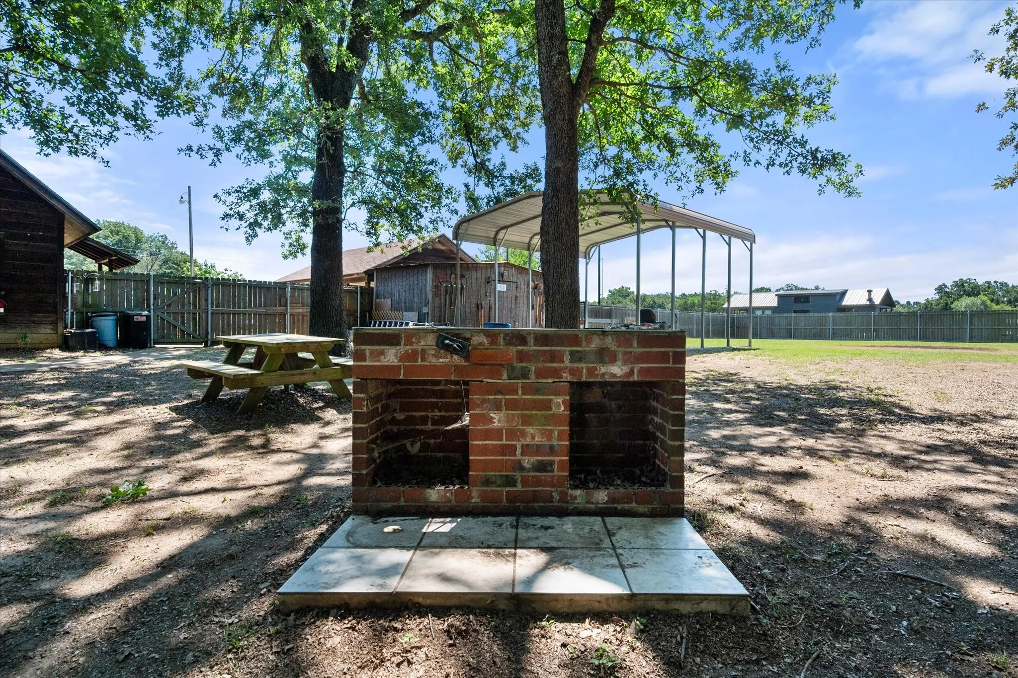 Built-in backyard barbecue area ready for outdoor gatherings.