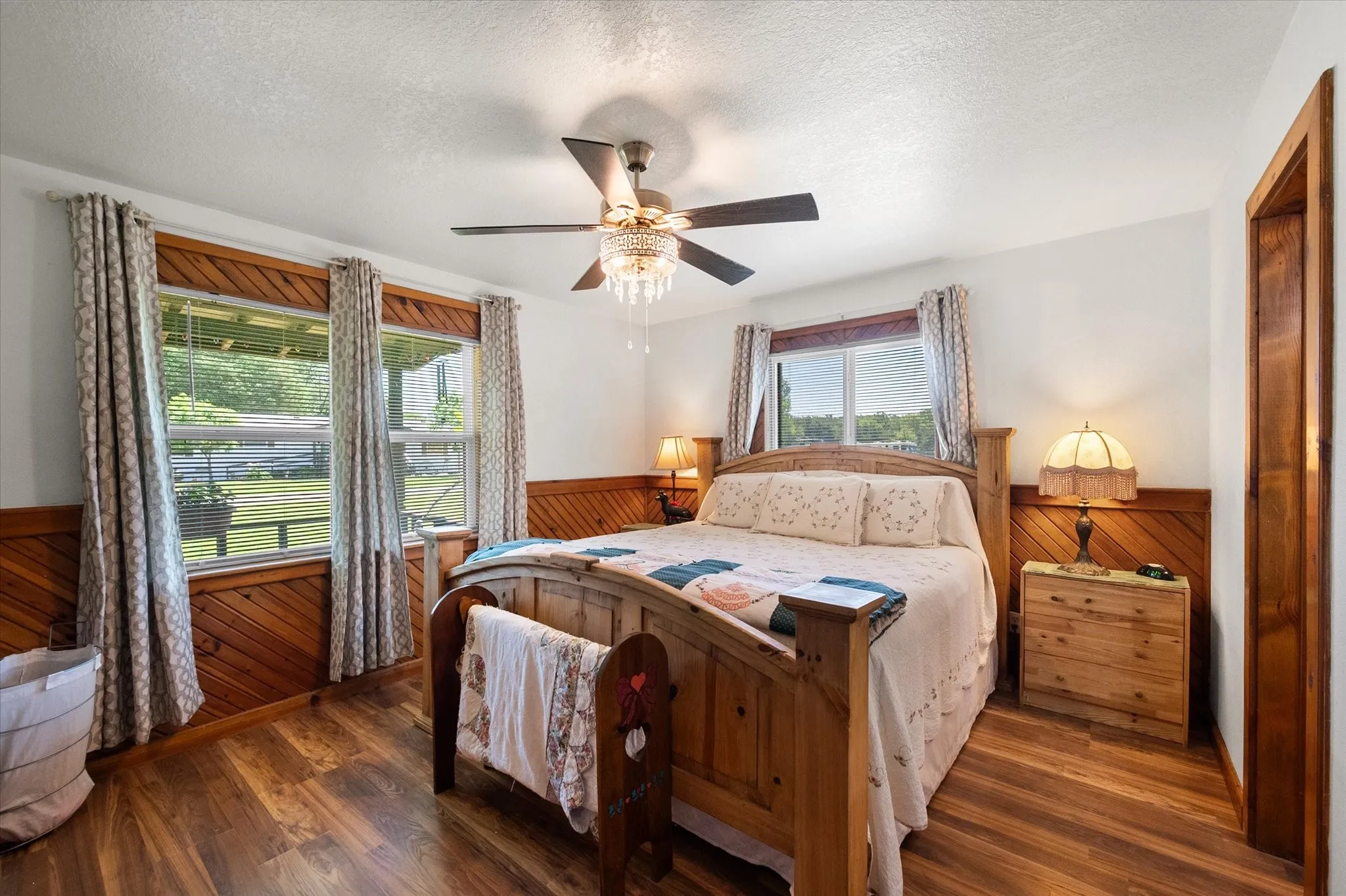 Spacious primary bedroom with backyard views and relaxing natural light.