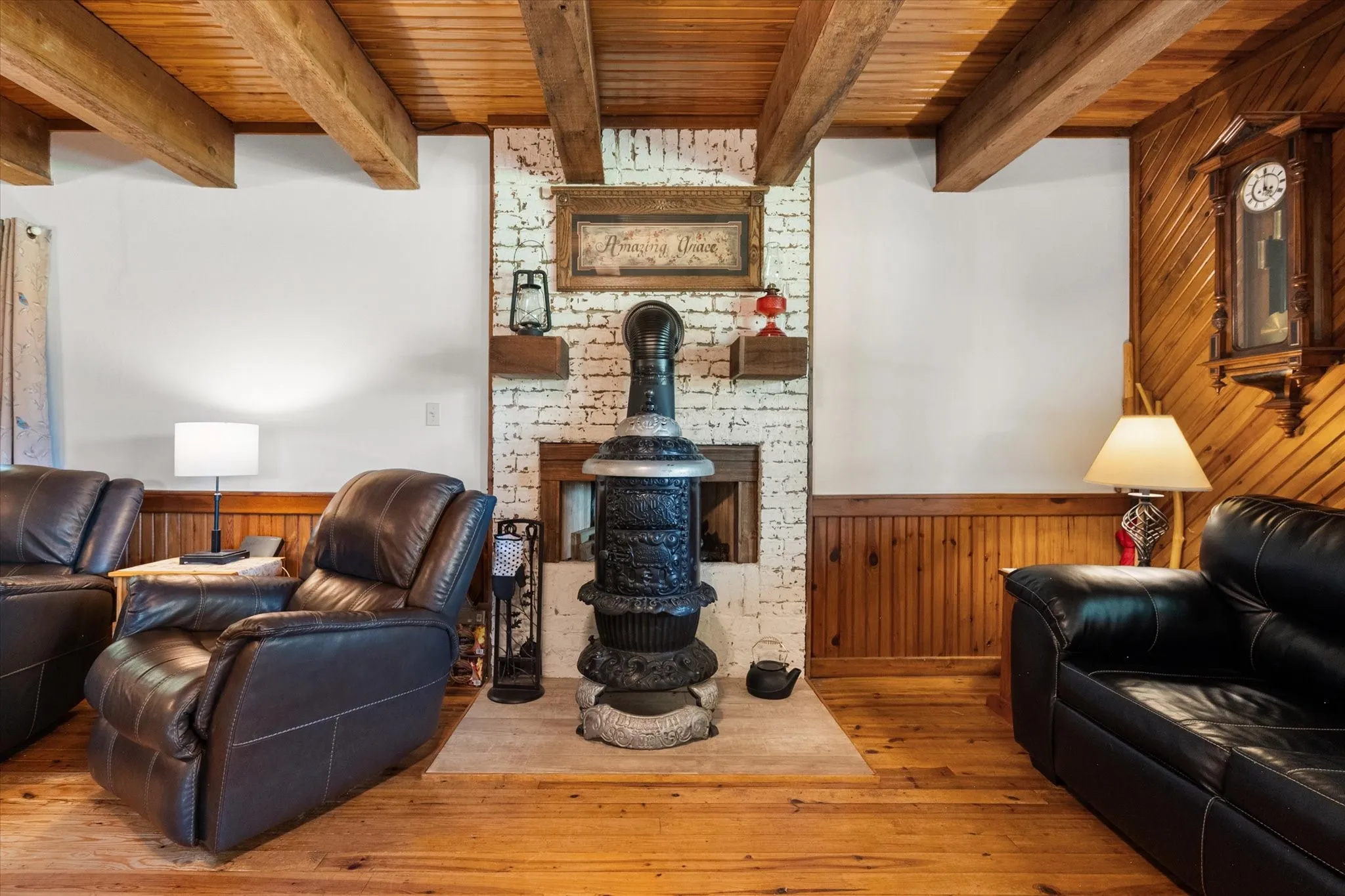 Cozy fireplace area featuring rustic cabin character and inviting entertaining space.