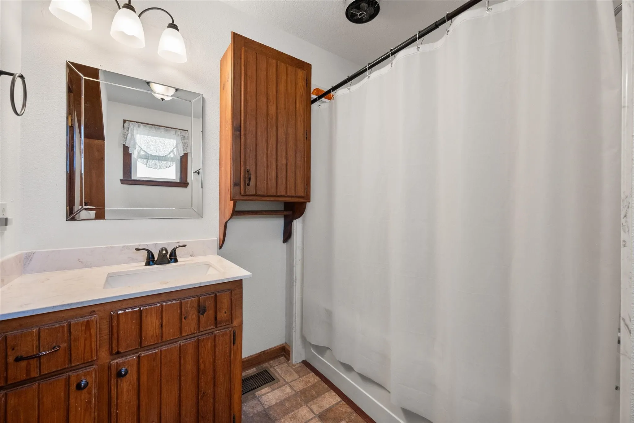 Bright full bathroom with updated finishes and spacious layout.