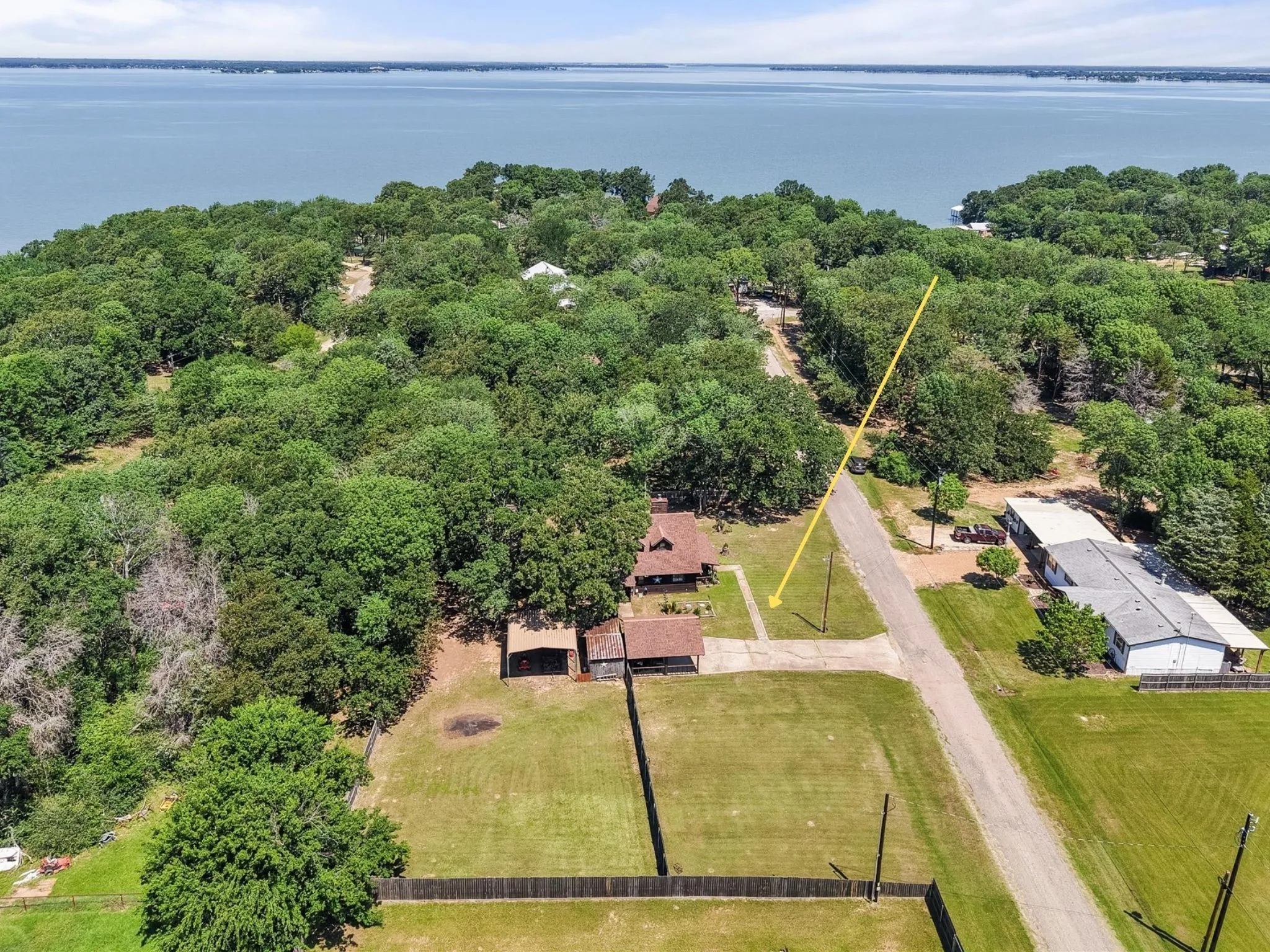 Aerial view showcasing the cabin nestled among mature trees in Southern Oaks.