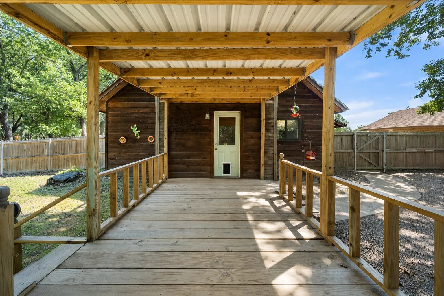 Oversized covered back deck perfect for outdoor dining, grilling, and entertaining.