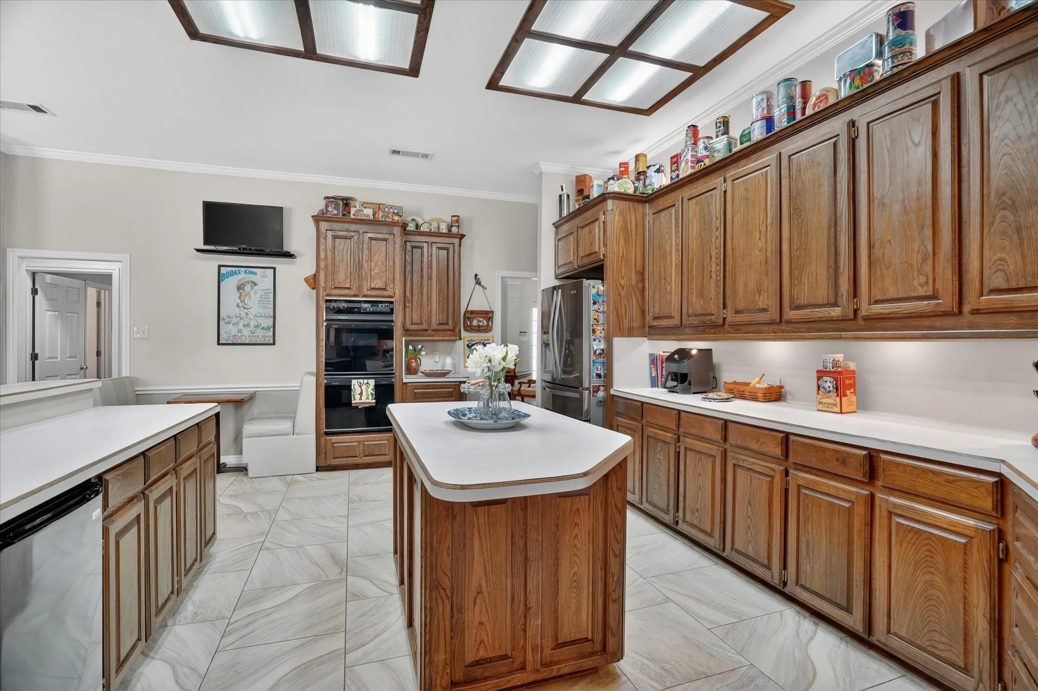 Double oven and island with extra storage.