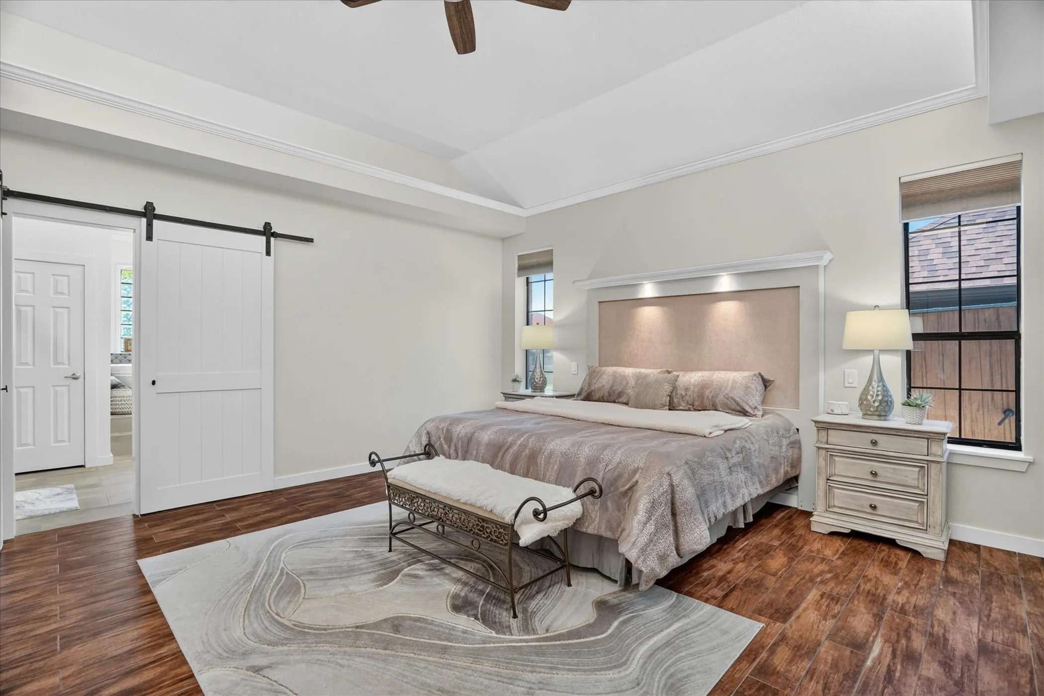 Primary Bedroom with farm style door.