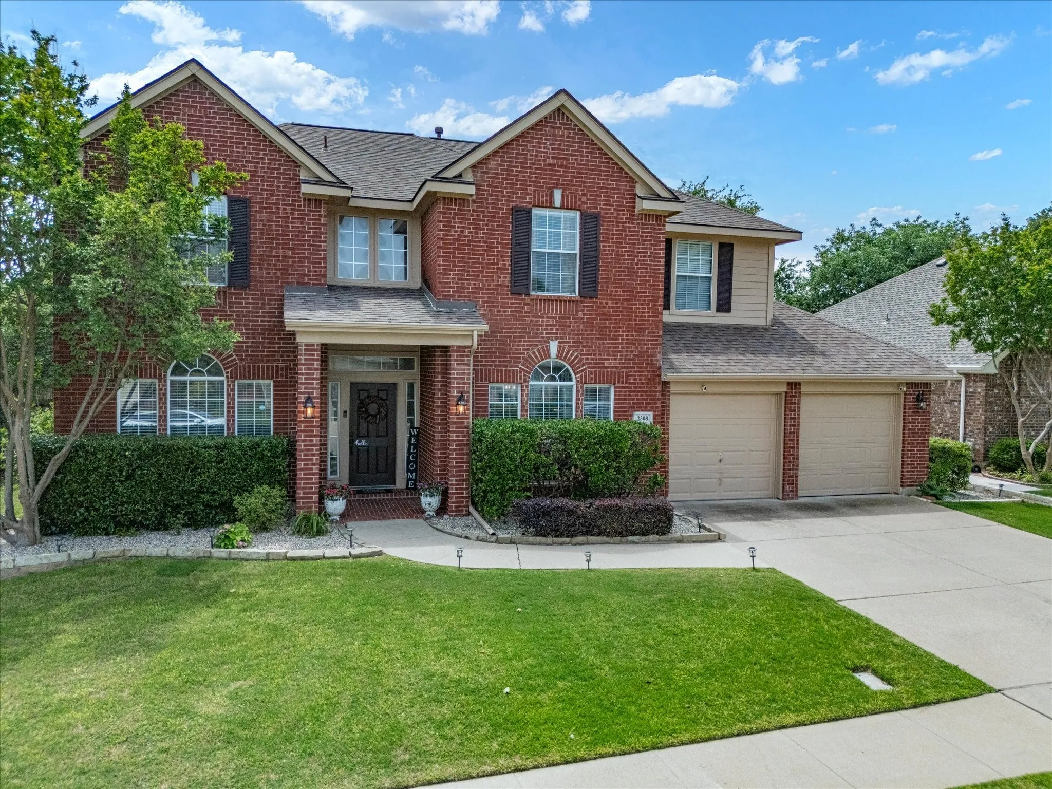 Brick facade property with a two-car garage