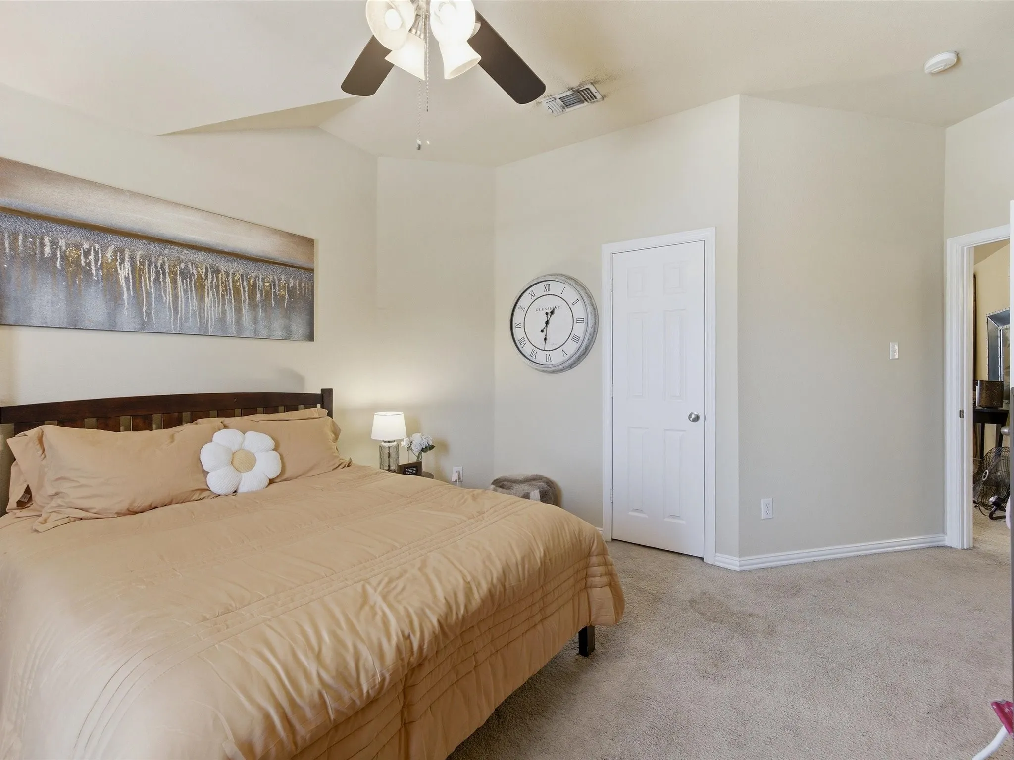 Bedroom featuring vaulted ceilings and neutral wall tones