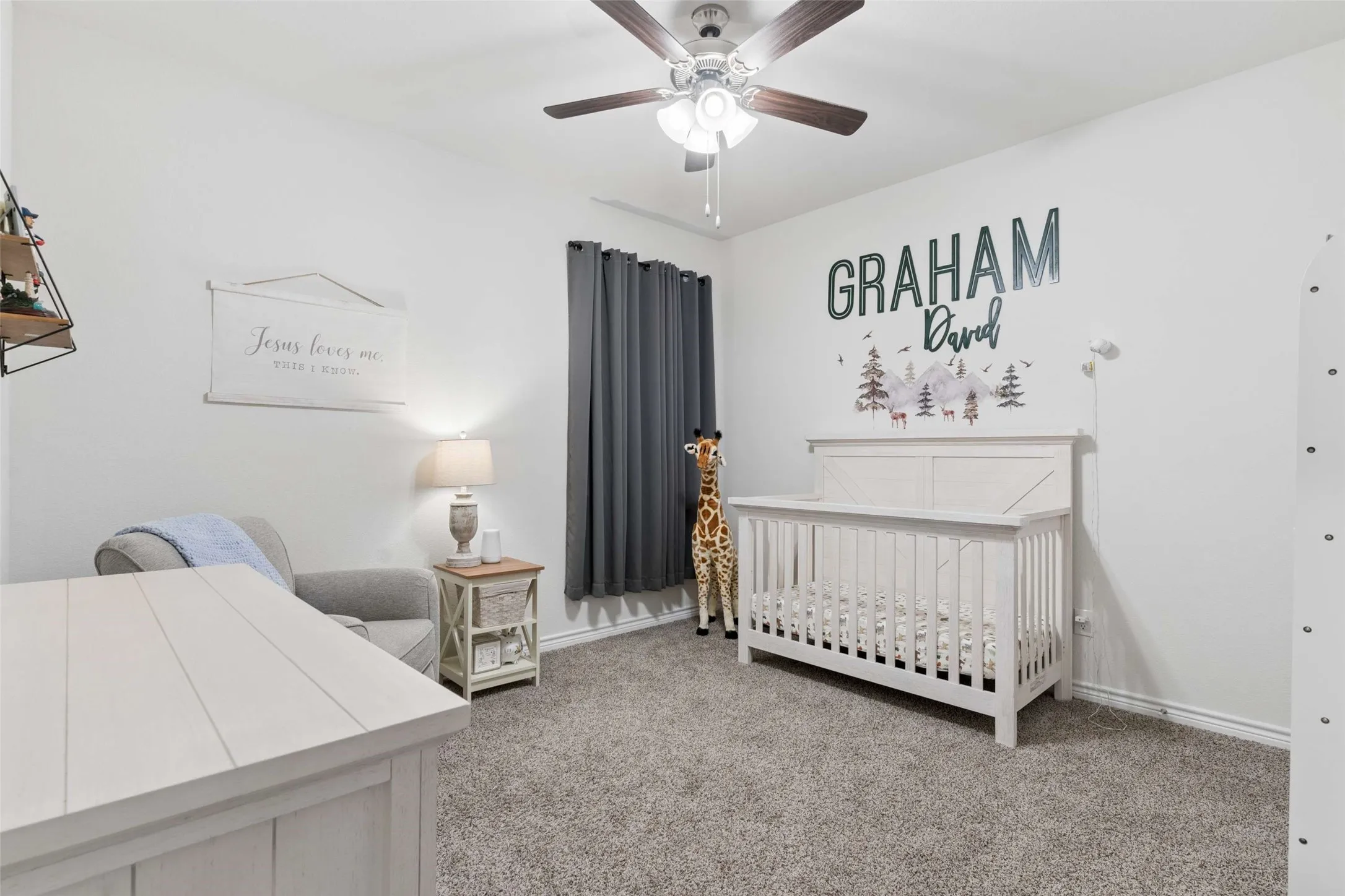 Plush gray carpeting and white baseboards