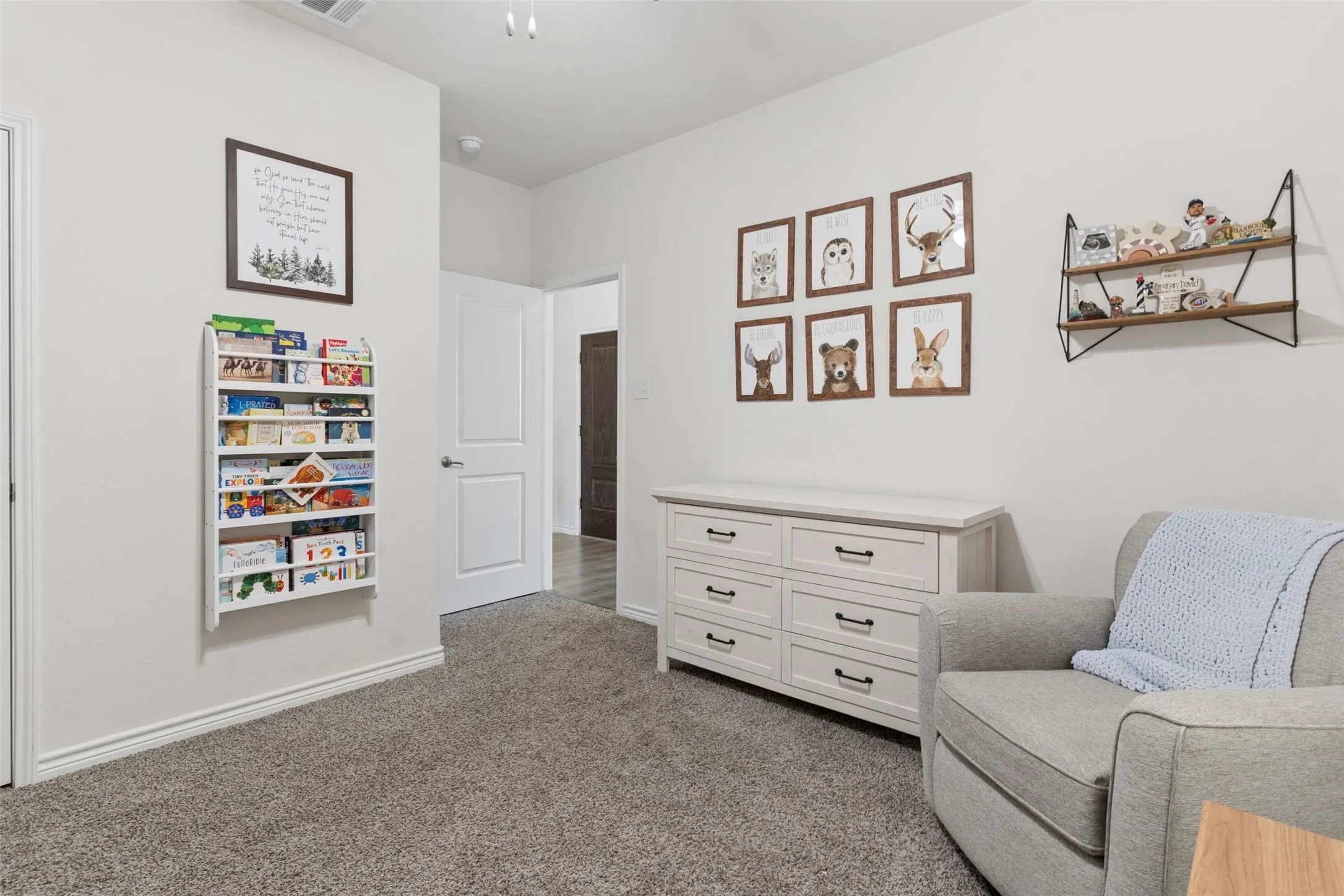 Wall-to-wall carpeting and neutral wall tones create a versatile interior
