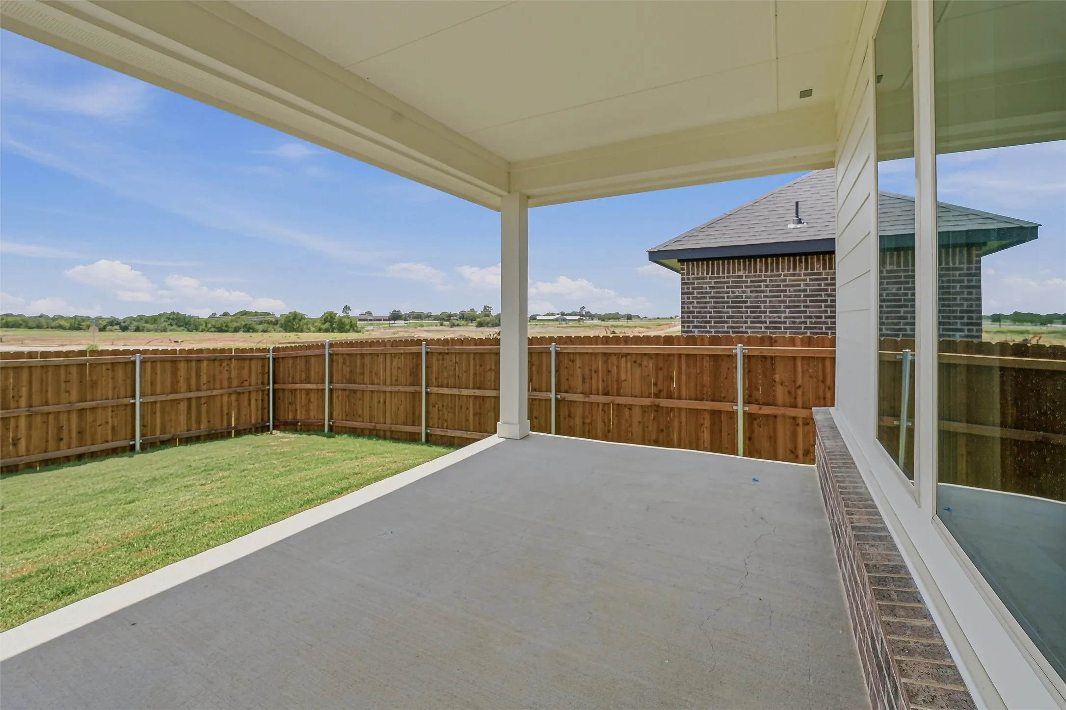 Covered patio featuring a concrete slab and ceiling fan pre-wire
