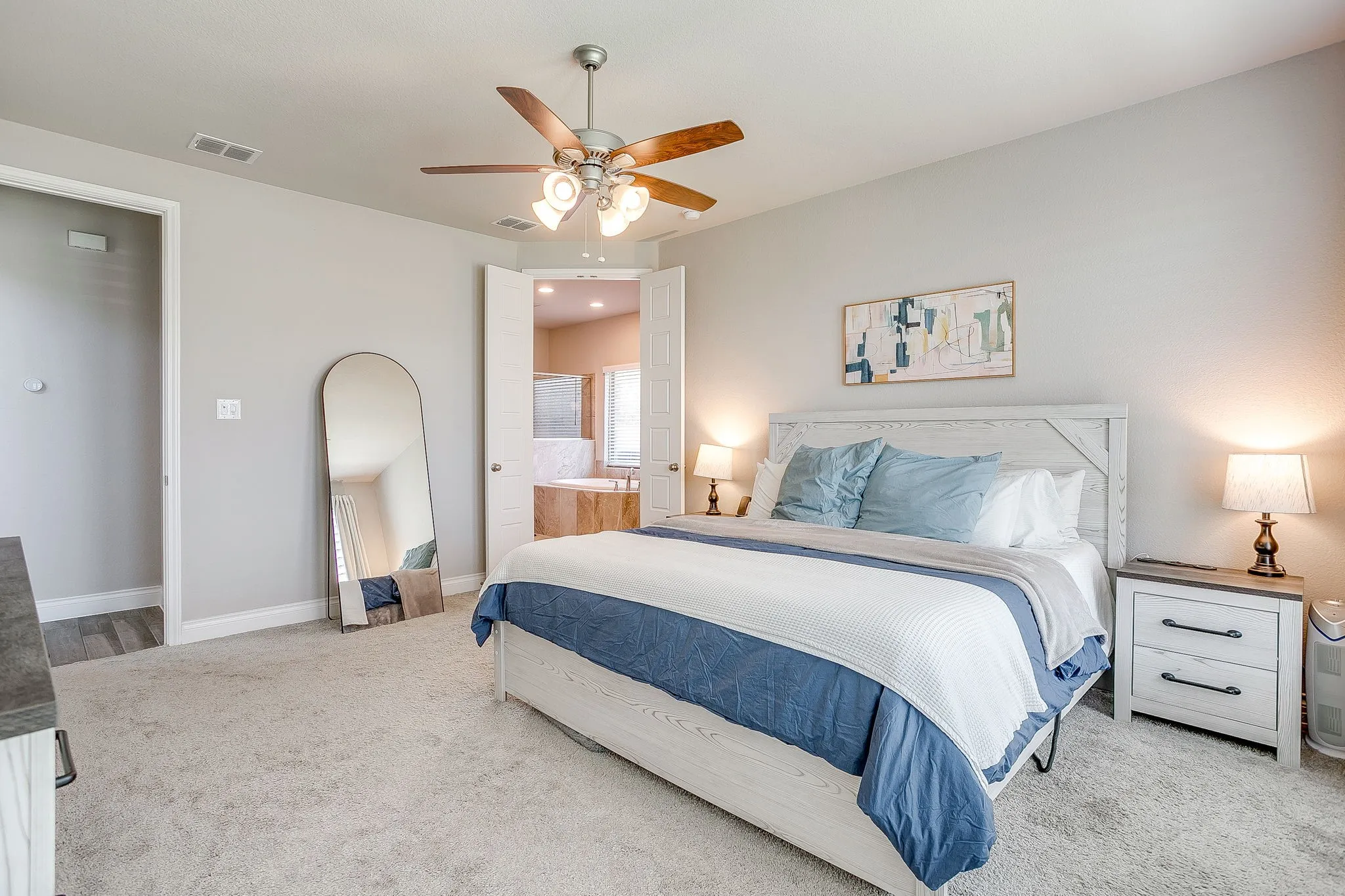 French double doors lead you into your private bathroom oasis.
