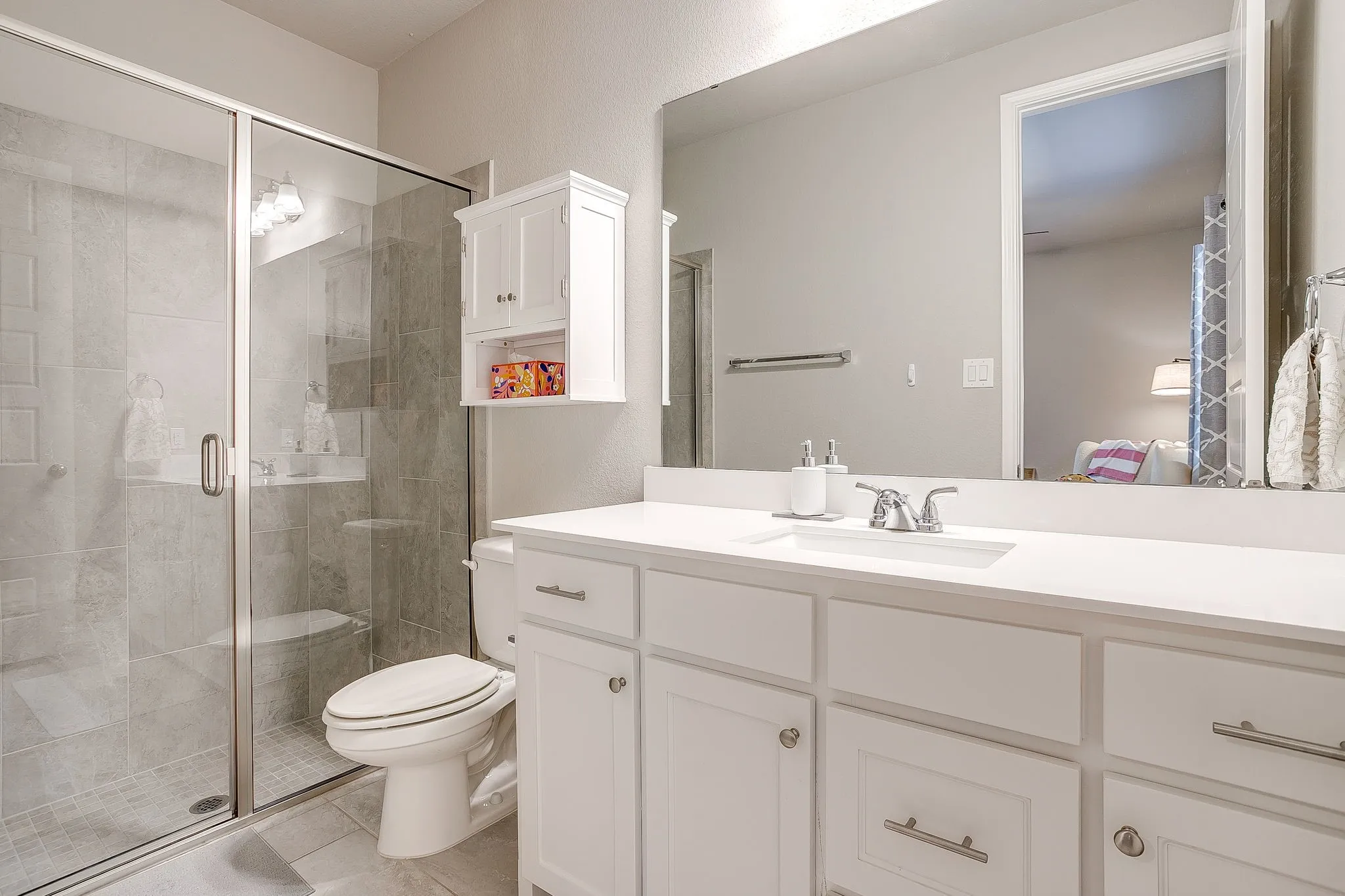 Private ensuite bathroom for the main-floor guest bedroom.
