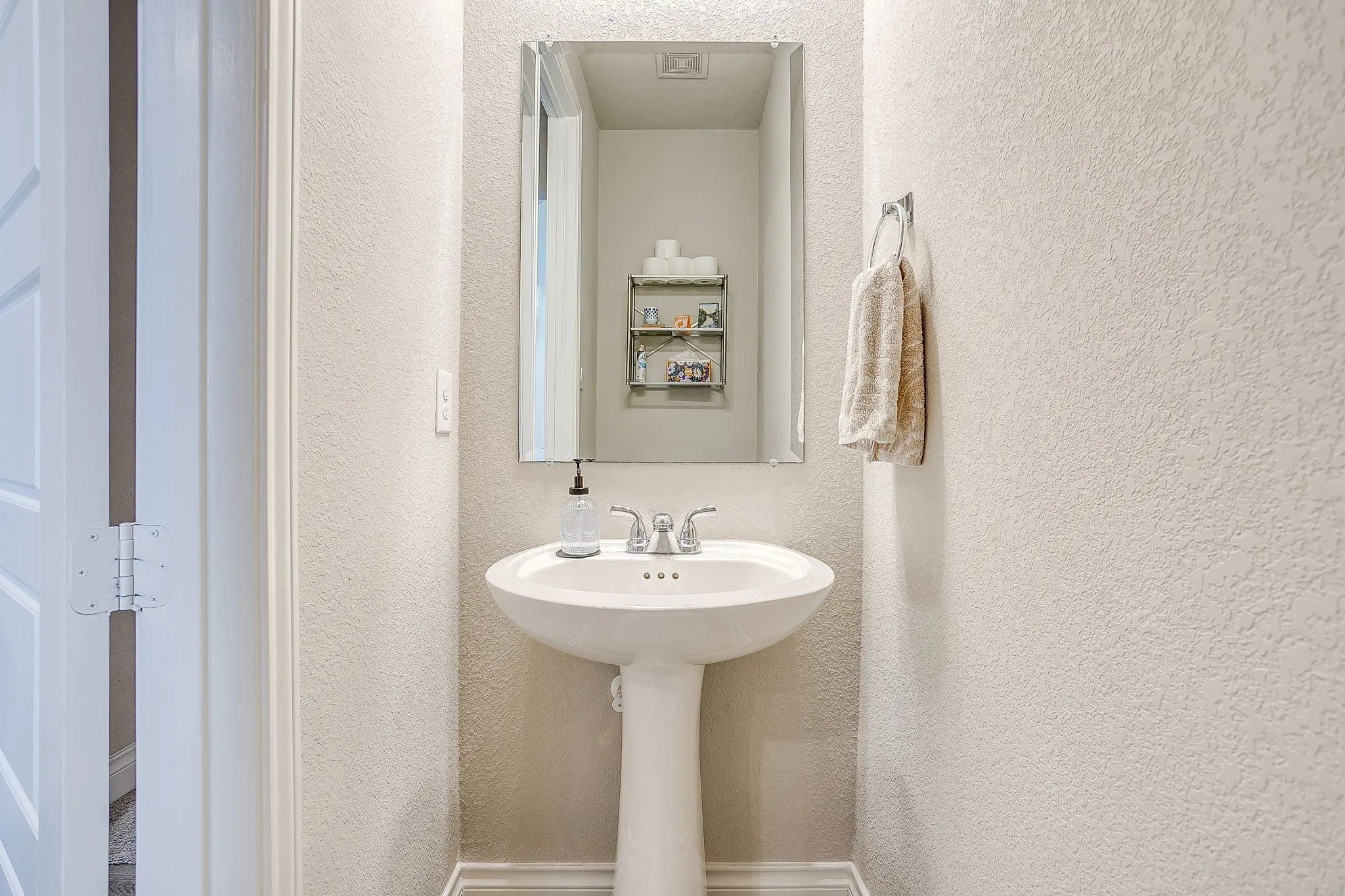 Conveniently located off the main living area, this main-floor half bath is perfect for family and guests.
