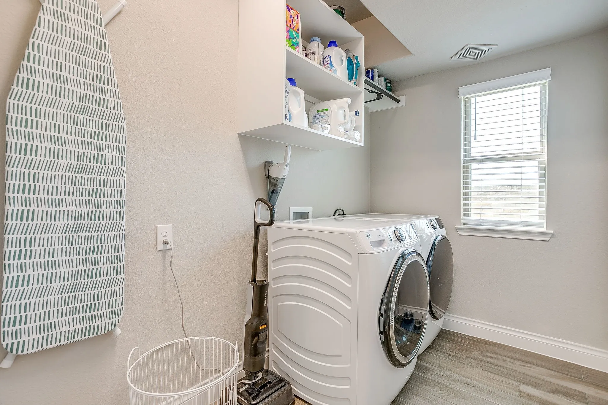 The laundry room is conveniently located on the main floor and offers plenty of storage space, plus extra room for a fridge, freezer, or built-in folding area!
