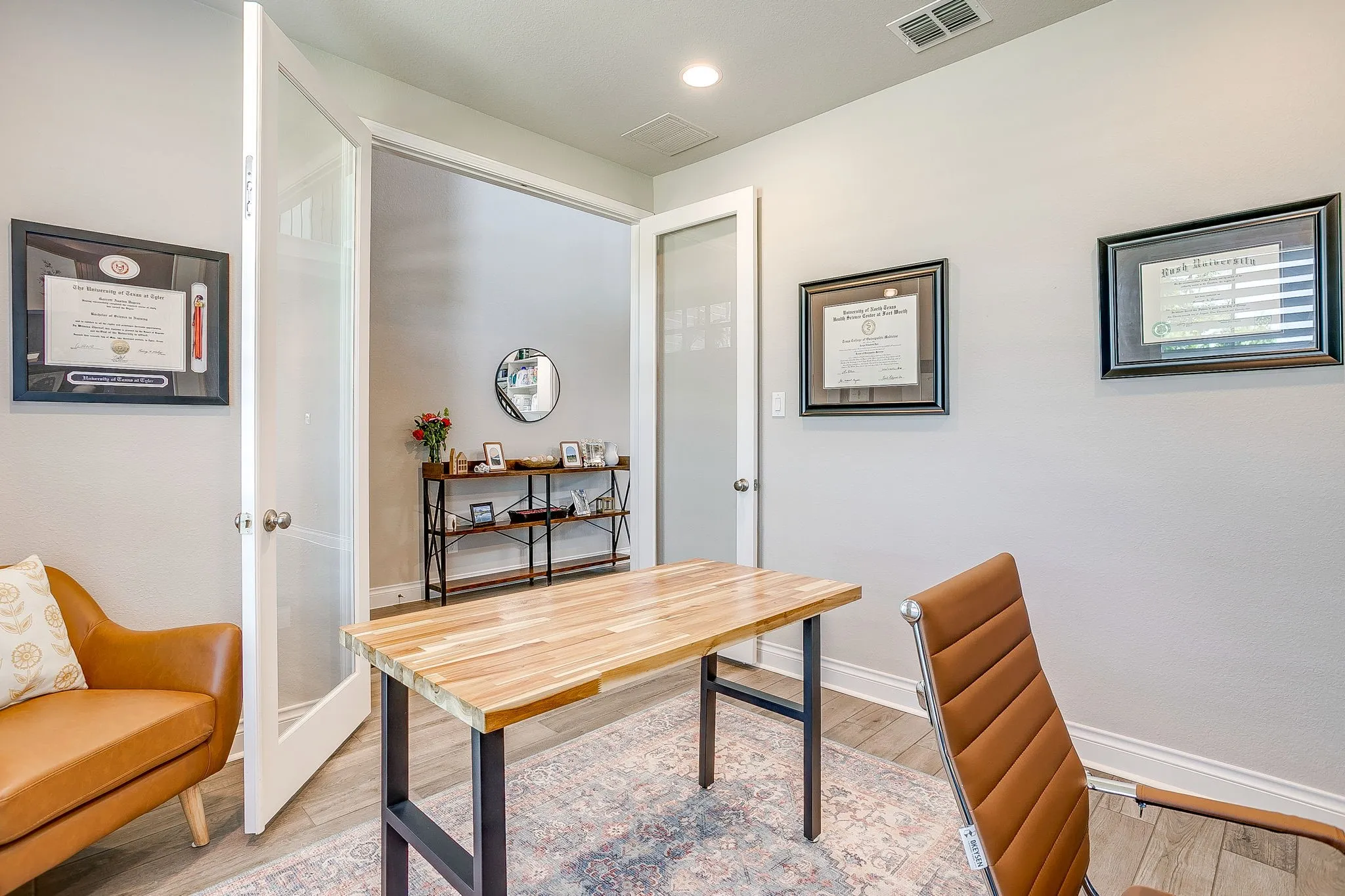 French glass doors lead seamlessly into the hallway and the rest of the home.
