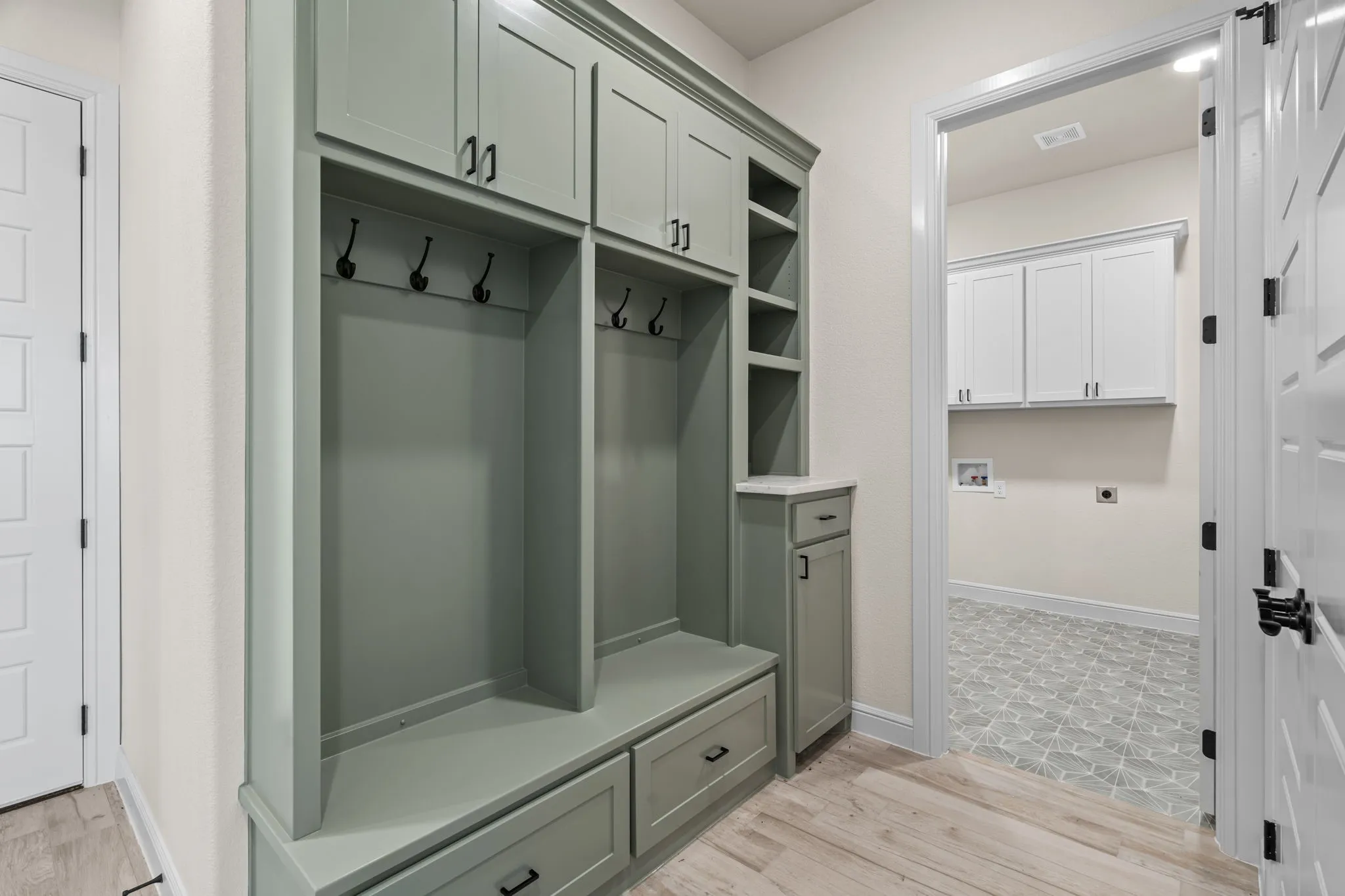 Mudroom with Built-In Cabinetry, Hooks and Drawers makes for great storage