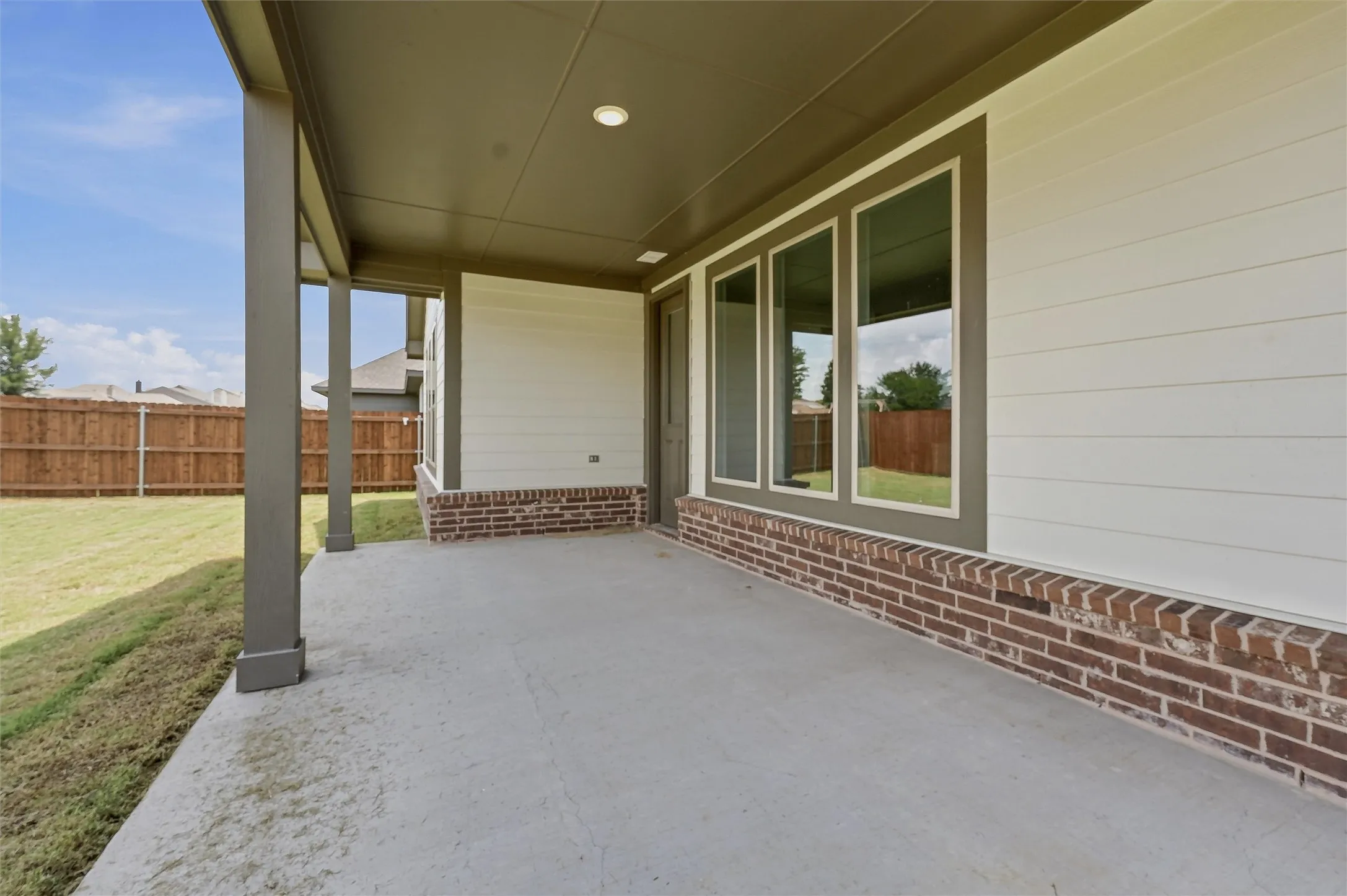 Covered patio featuring a concrete surface, recessed lighting, and support columns