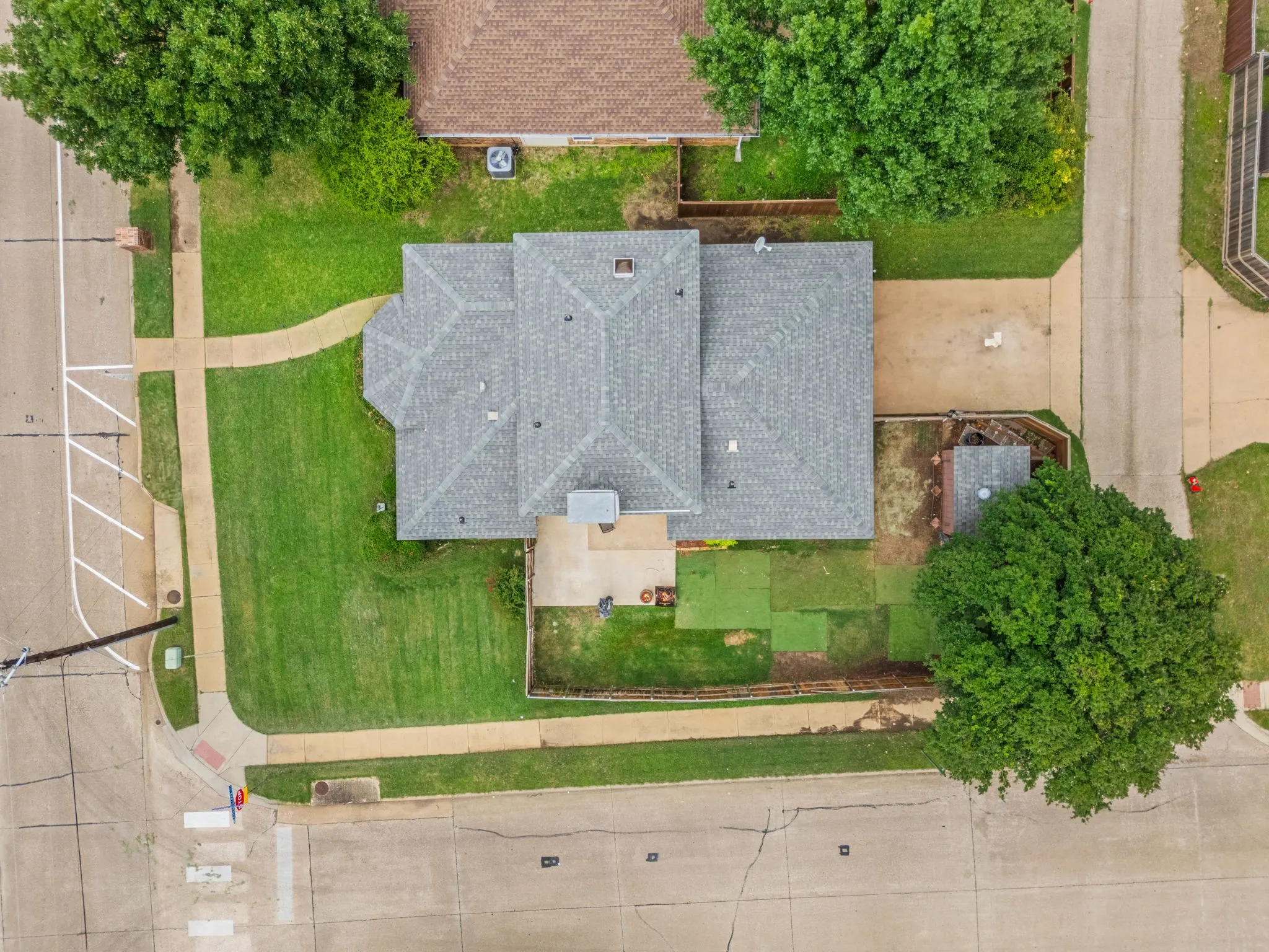 The driveway and garage at 2060 Arbor Creek Drive #B, a home with a two car garage in Carrollton, TX 75010.