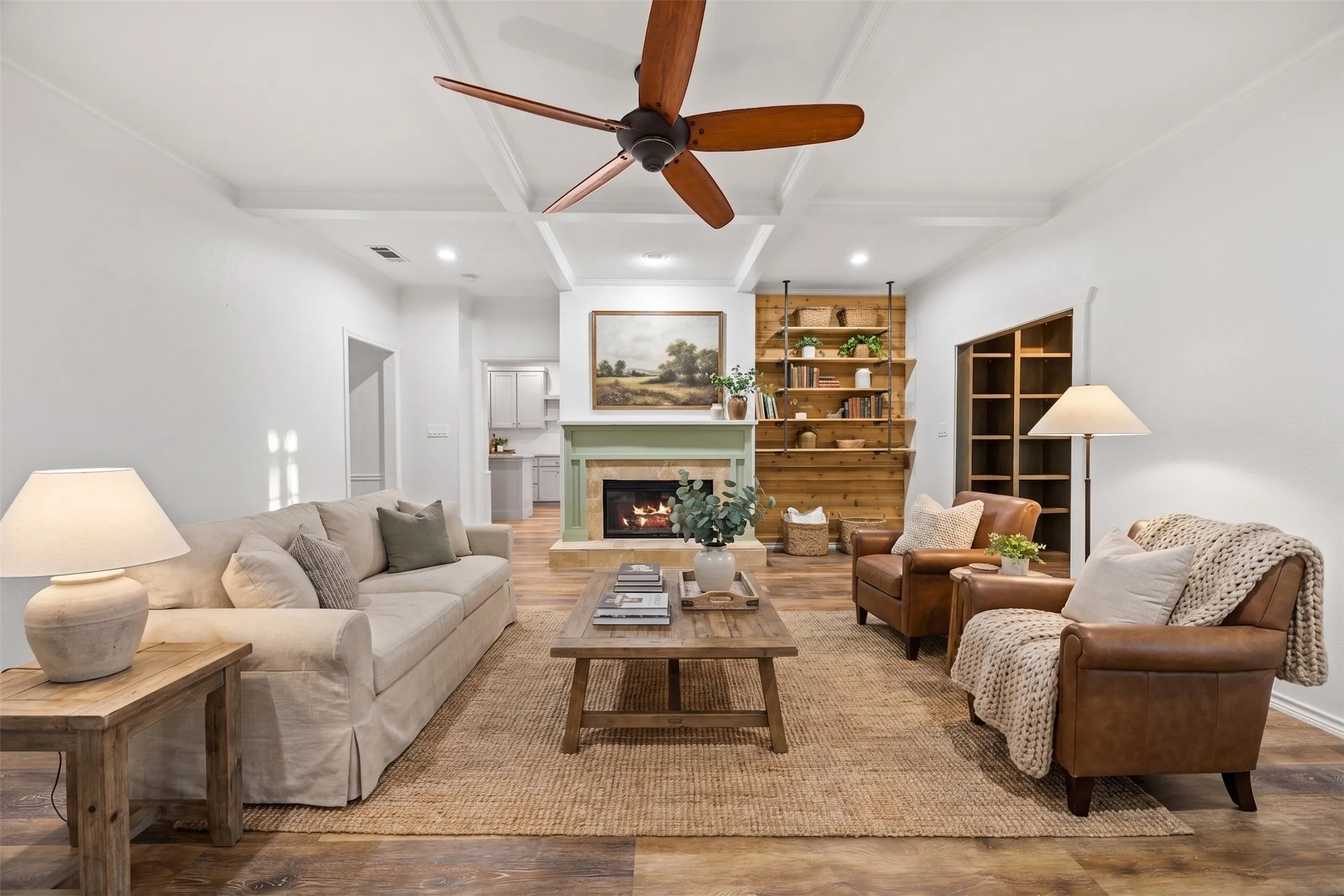 Living area featuring coffered ceilings and wood-finish flooring
