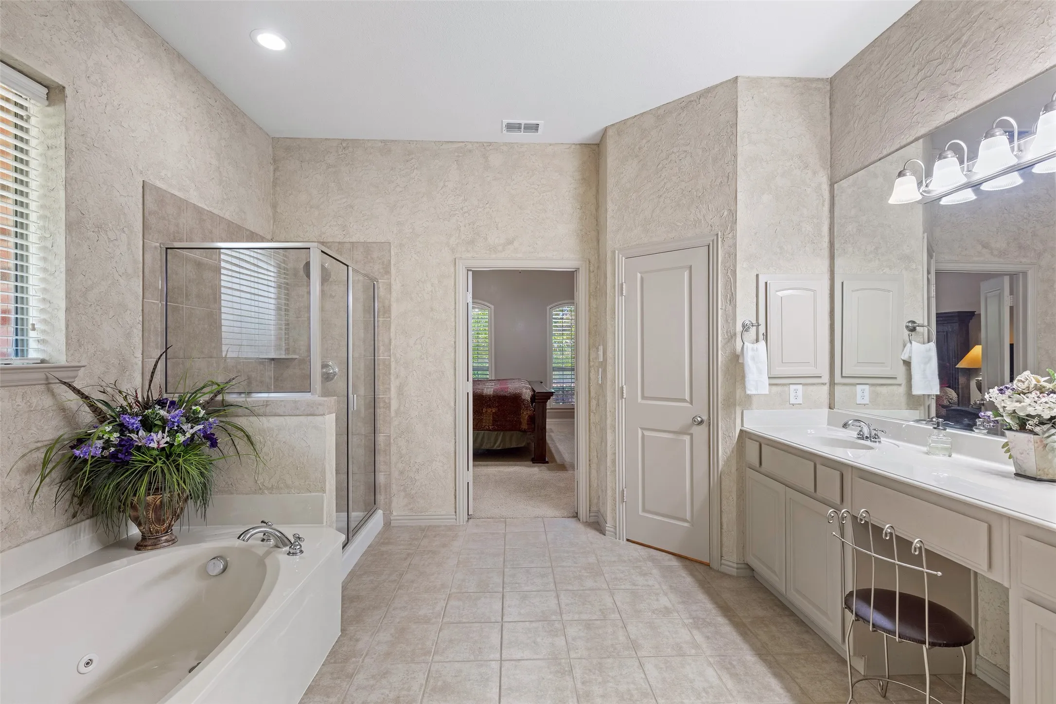 Begin and end each day in a spacious ensuite featuring a soaking tub, separate shower, and generous vanity.