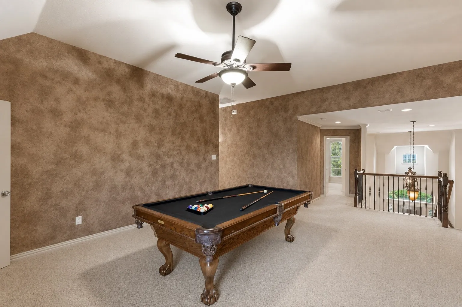 Designed for entertaining and everyday fun, the oversized game room offers endless possibilities for billiards, gaming, or a relaxed upstairs lounge space.