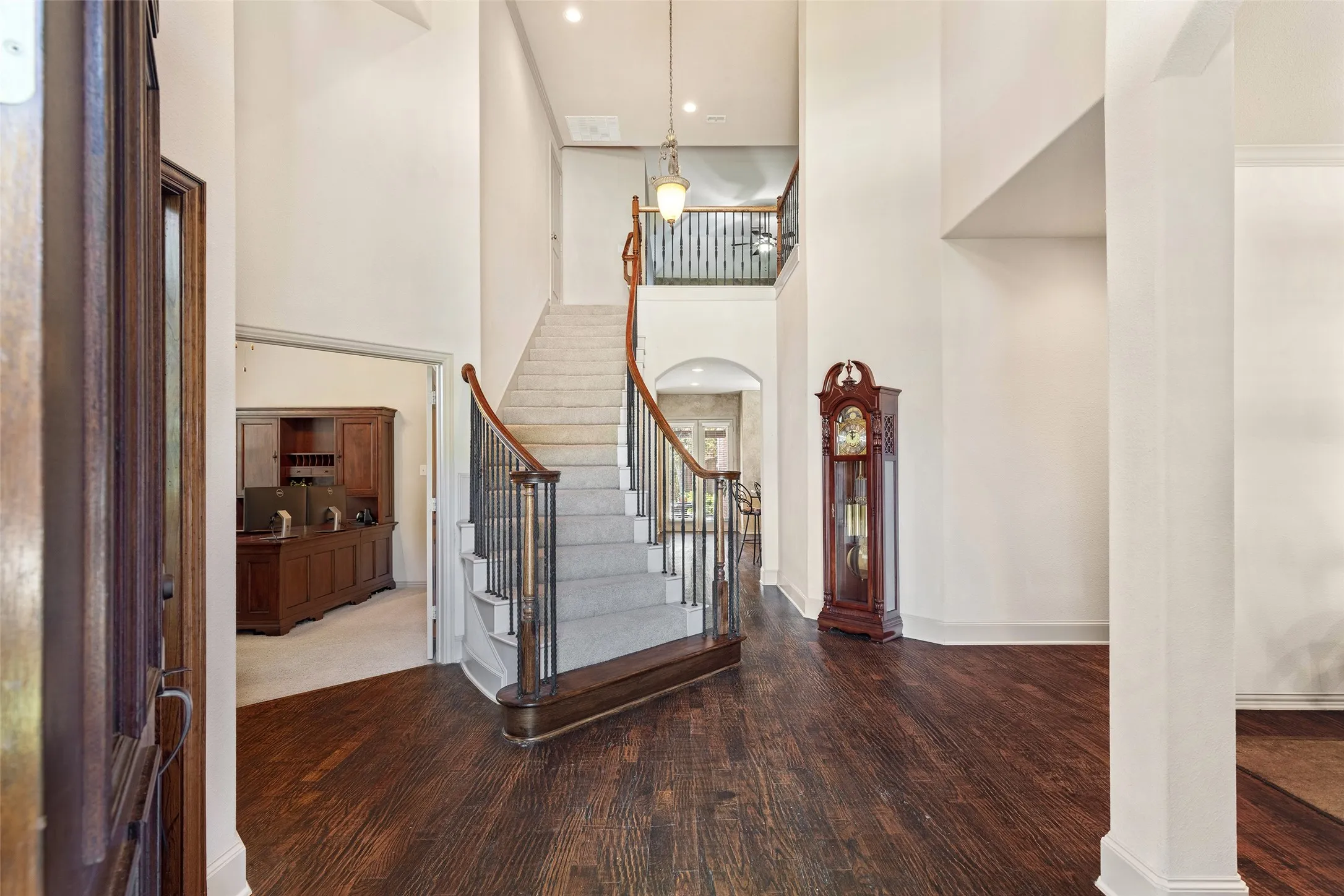 Step inside to a grand staircase and rich hardwood floors that set an elegant tone.