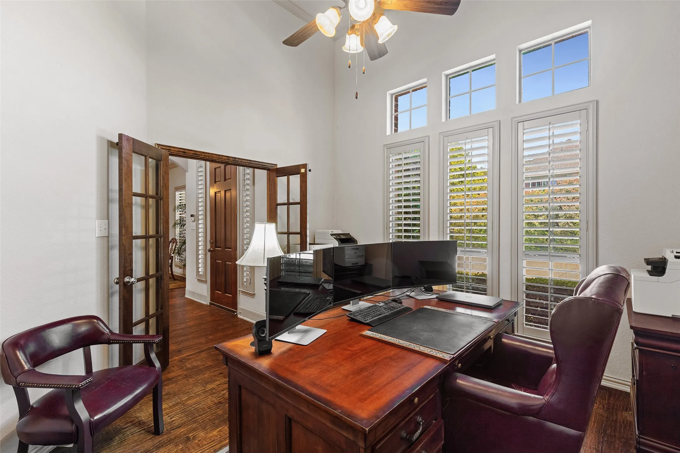 Plantation shutters add timeless character and privacy. It’s an inviting place to work, read, or plan the day.