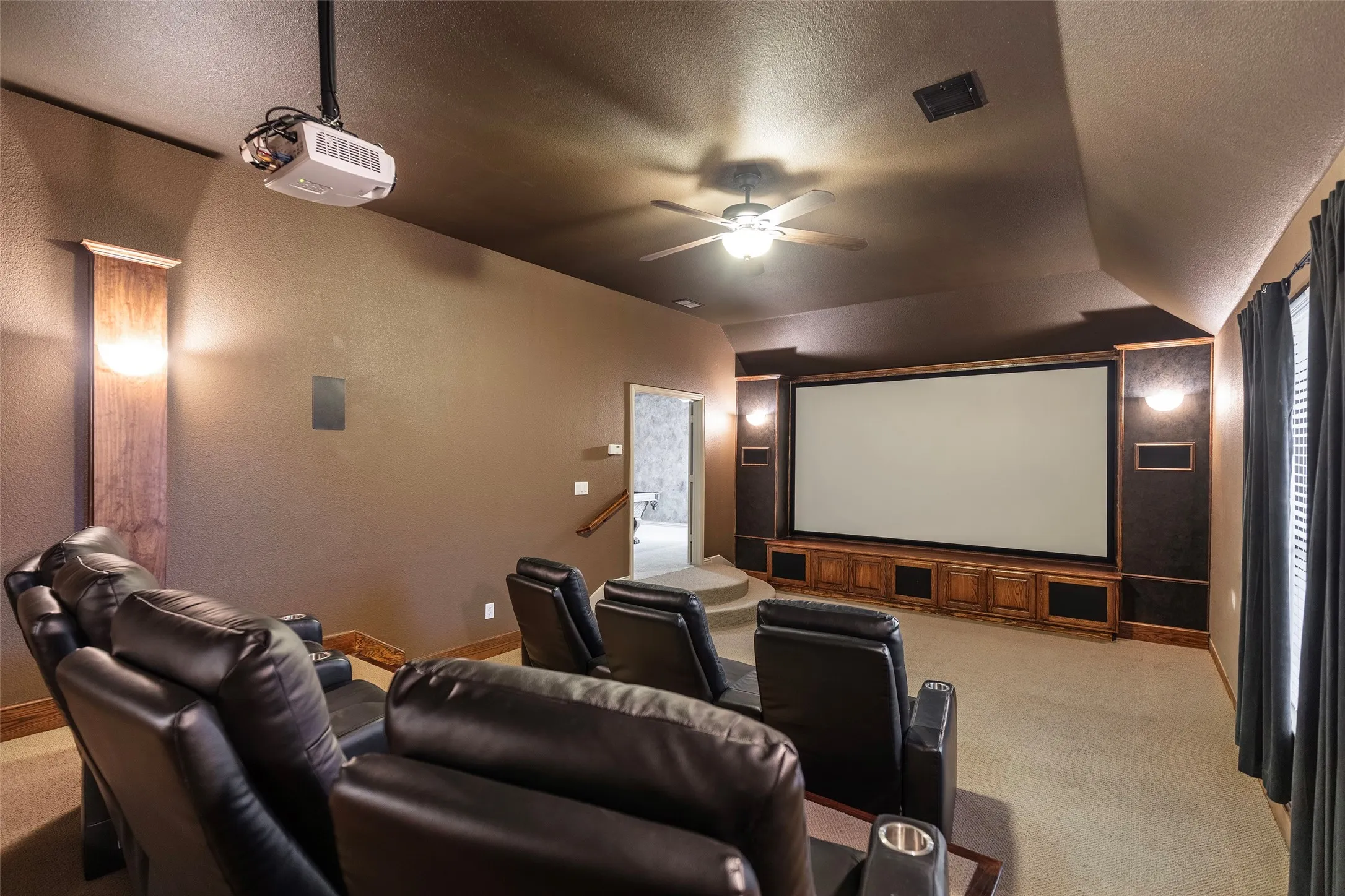 Movie nights become special occasions in the private theater with a large projection screen.