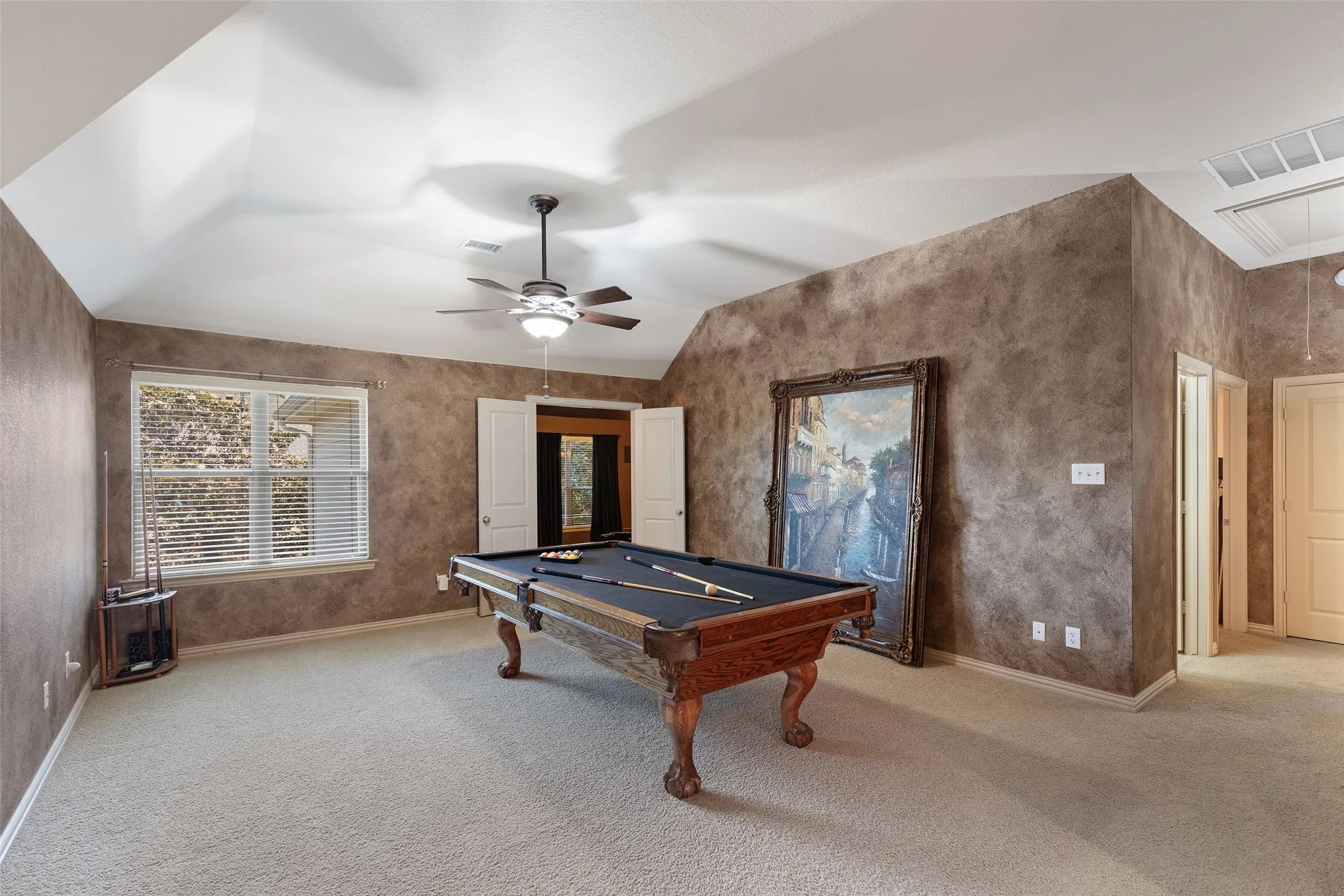 Challenge friends to a game of pool before settling in for movie night just steps away.