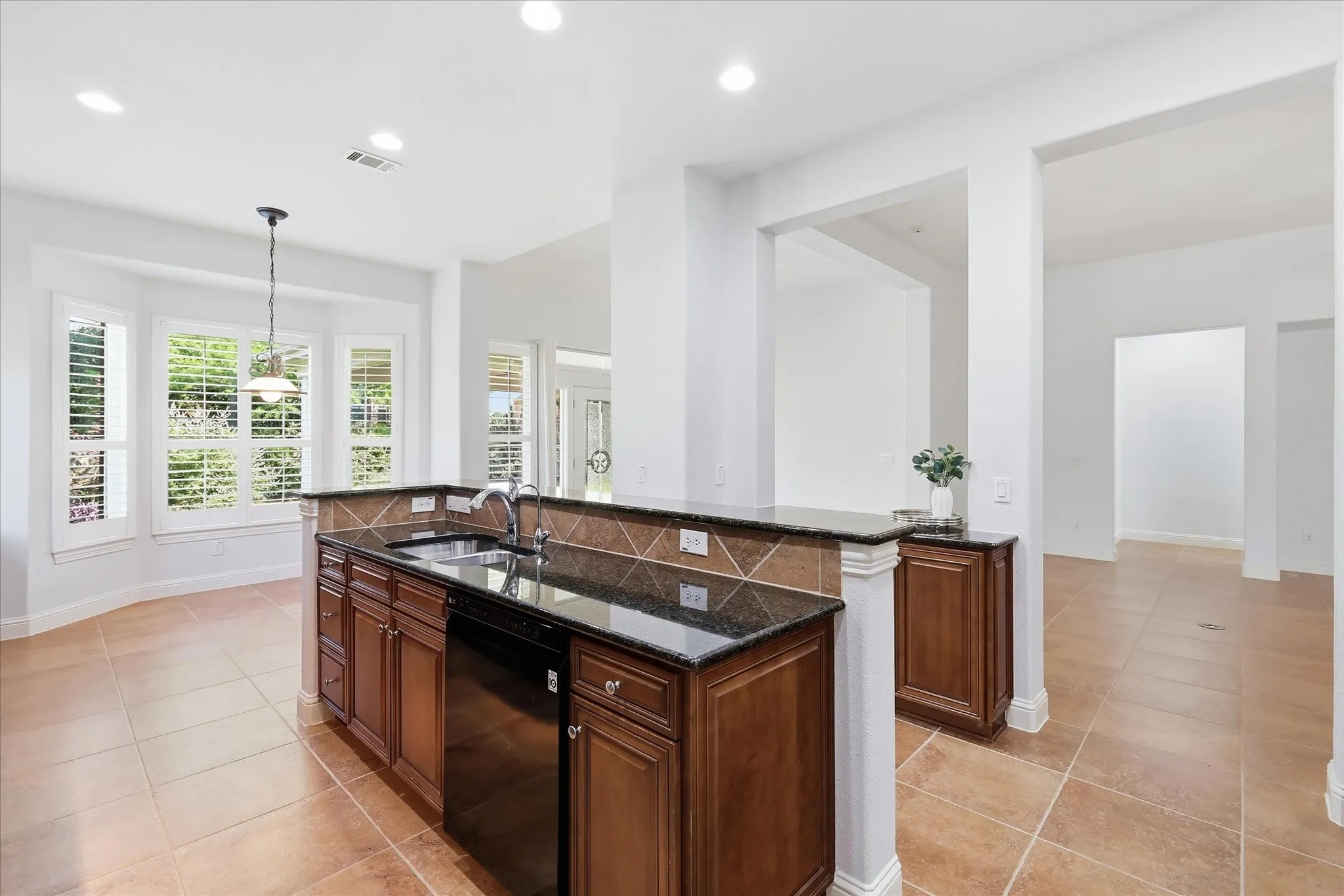 Island with sink and dishwasher.